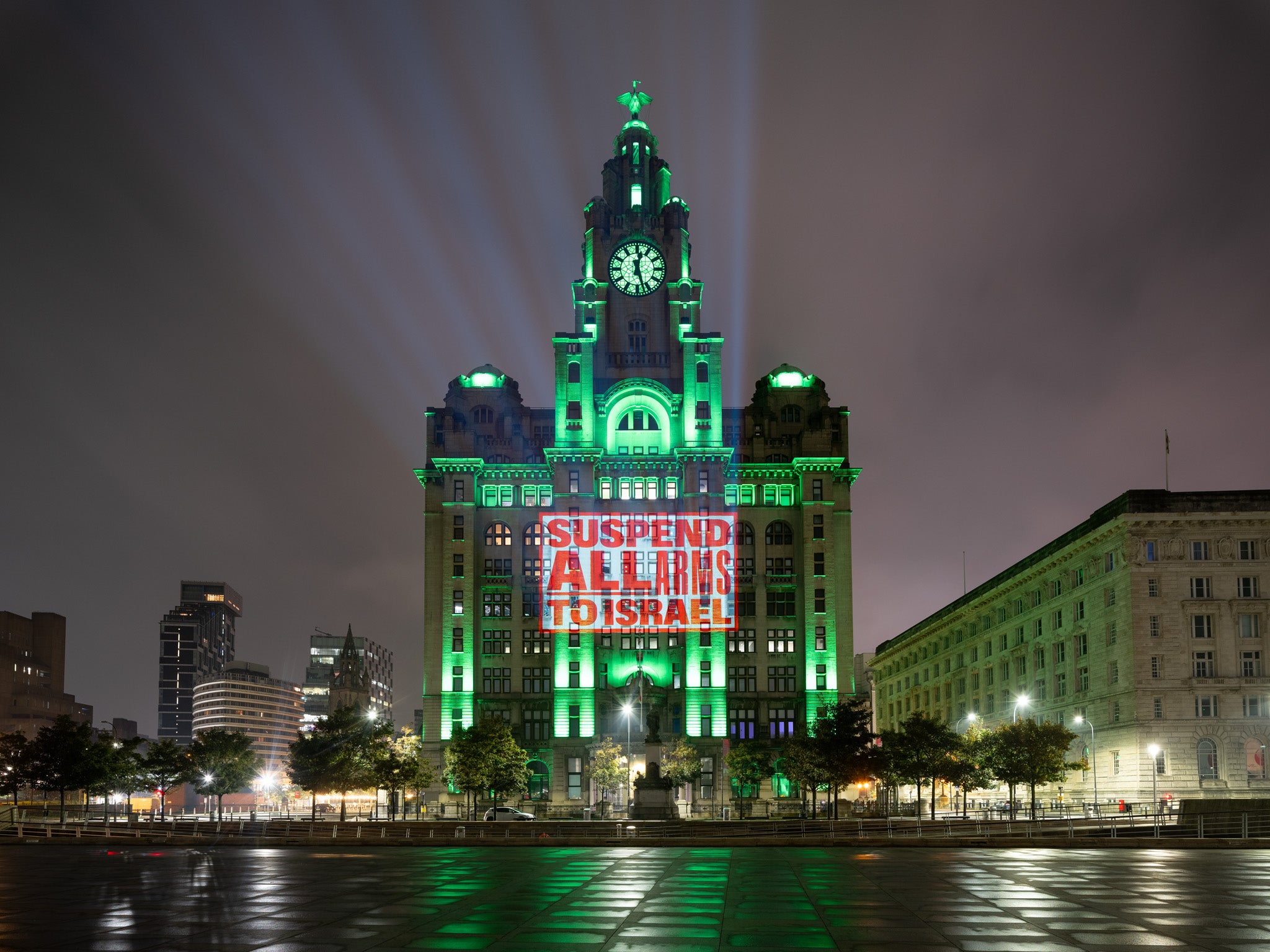 Humanitarian organisations projected ‘Suspend all arms to Israel’ onto the Liver Builidng during Labour confernce last night