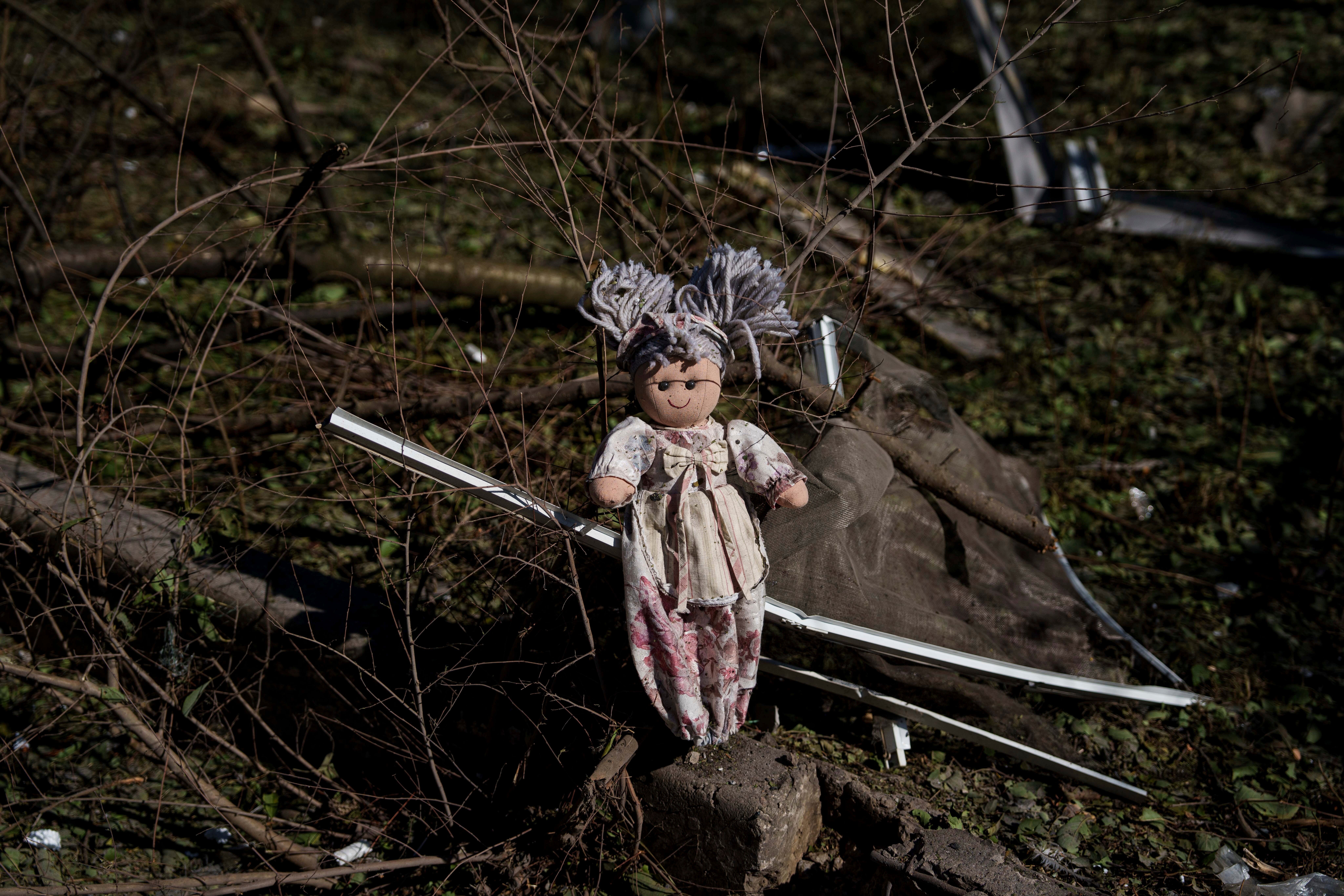 A doll lies on the ground near a residential building which was hit by a Russian bomb in Mykolaivka, Donetsk region