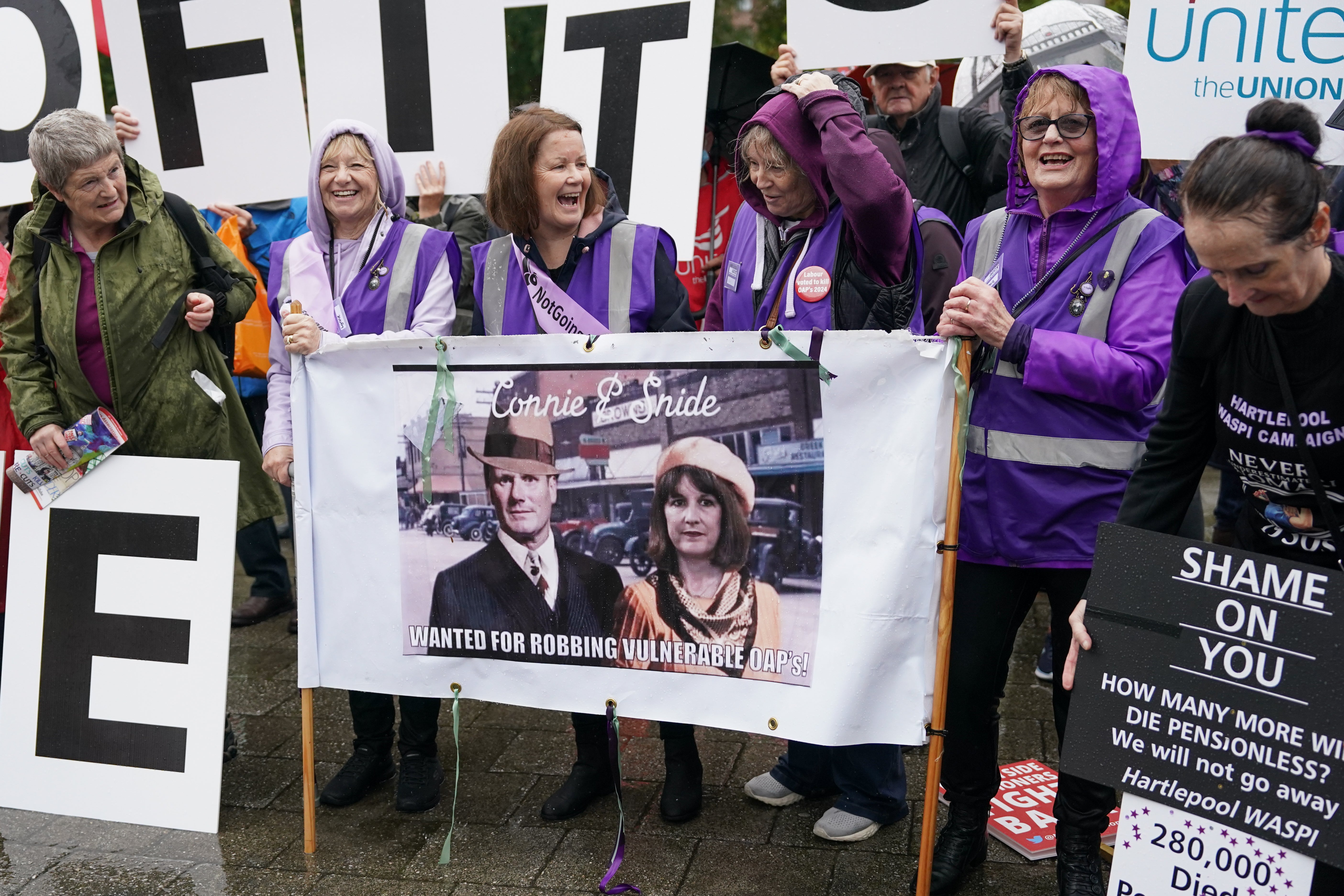 Protestors take part in a demonstration outside the Labour Party conference venue against the withdrawal of the winter fuel allowance