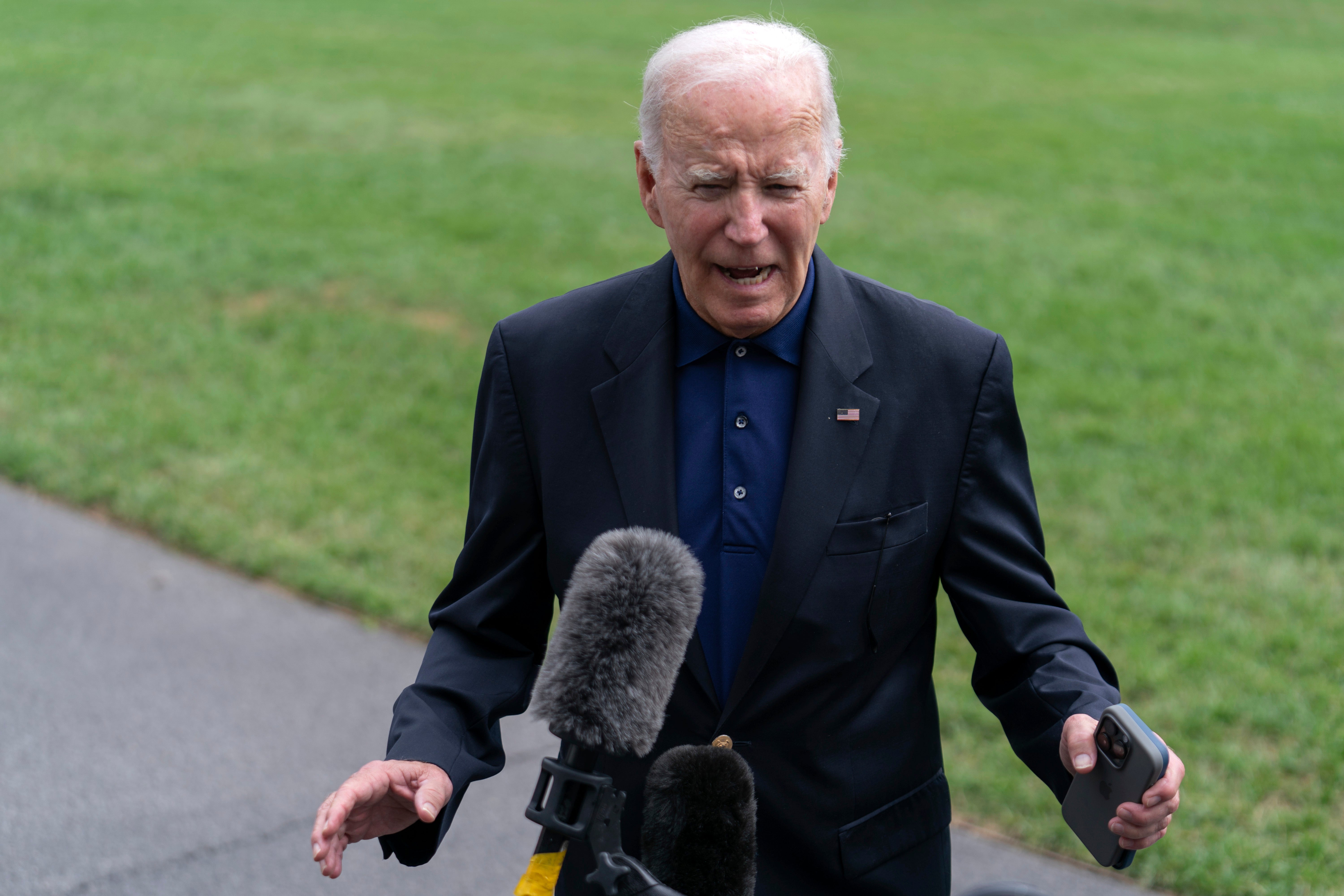 President Joe Biden talks to reporters at the White House on Sunday. Biden is expected to deliver a speech on Tuesday highlighting current and future economic progress under his administration.