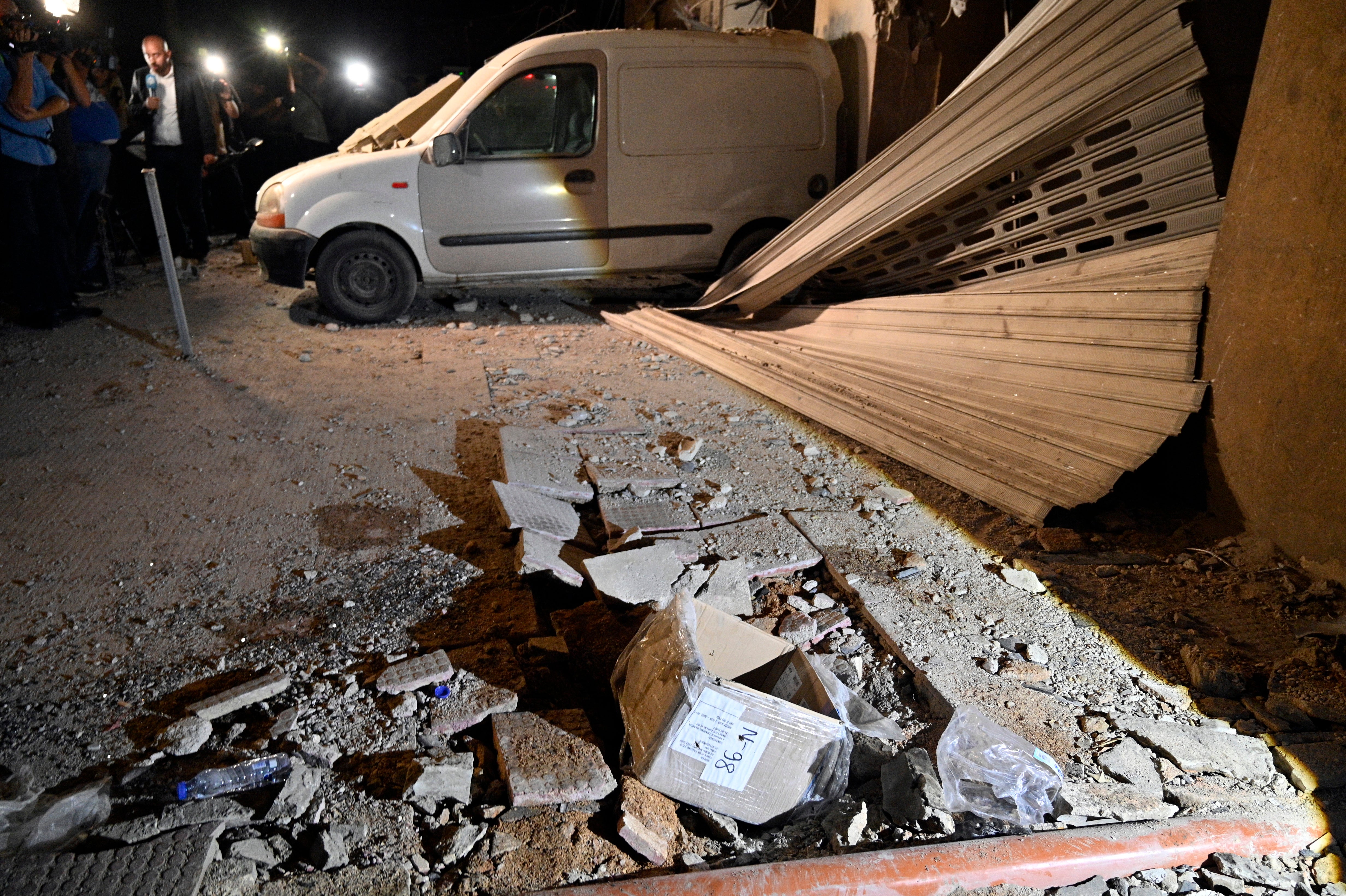 A damaged vehicle is seen in the southern suburb of Beirut after an Israeli military strike, in Beirut, Lebanon, 23 September 2024. The Israeli Defense Forces (IDF) said they conducted a 'targeted strike' in Beirut on 23 September after the Israeli military announced that it launched 'extensive' airstrikes on Hezbollah targets in Lebanon. Lebanese residents of villages in the Beqaa Valley 'who are inside or near houses where rockets and weapons are stored' have been warned to 'move away immediately! For your safety and protection', the statement added