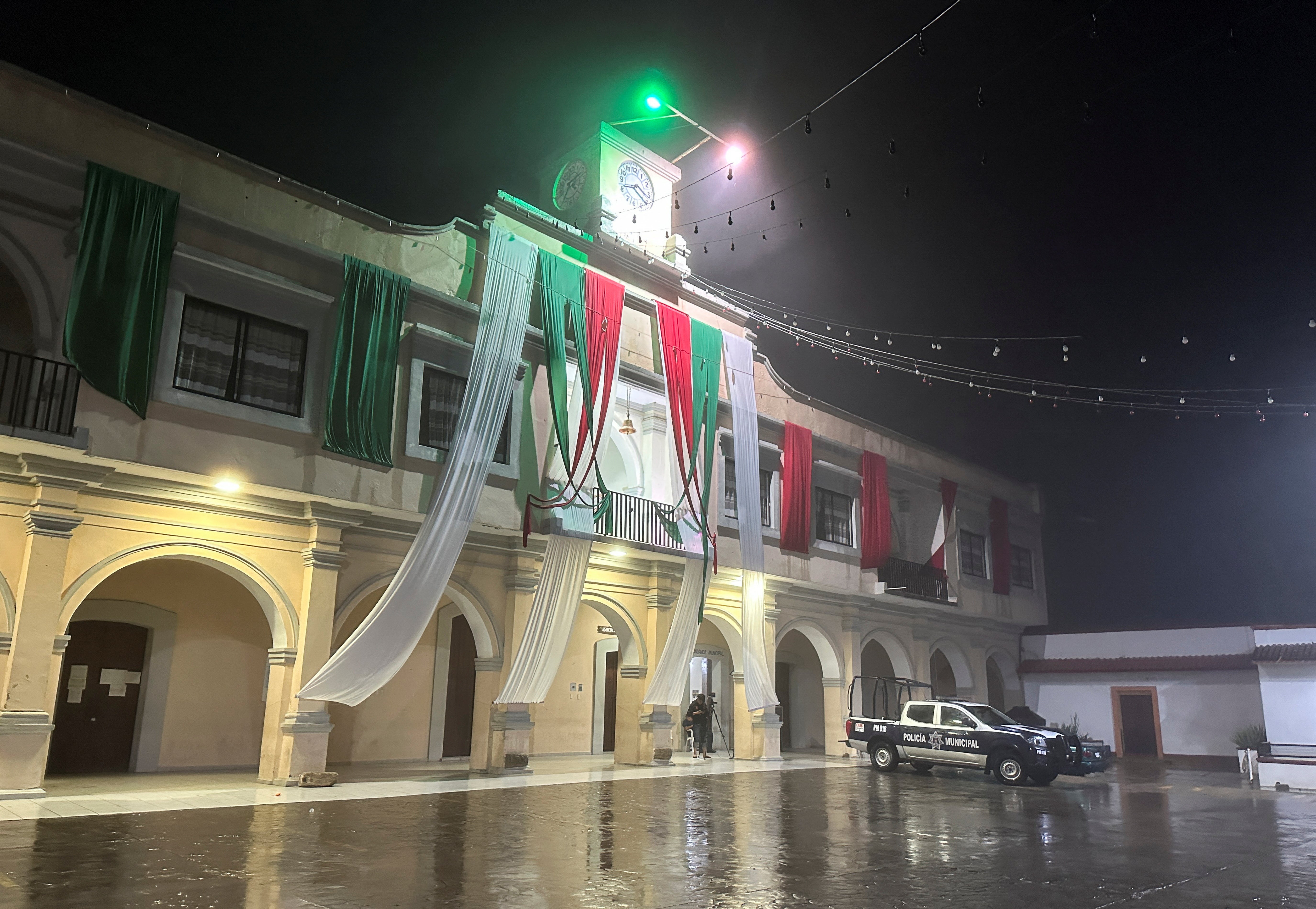 A police patrol vehicle is parked outside the municipal palace as Hurricane John makes landfall in Santiago Jamiltepec, Oaxaca state