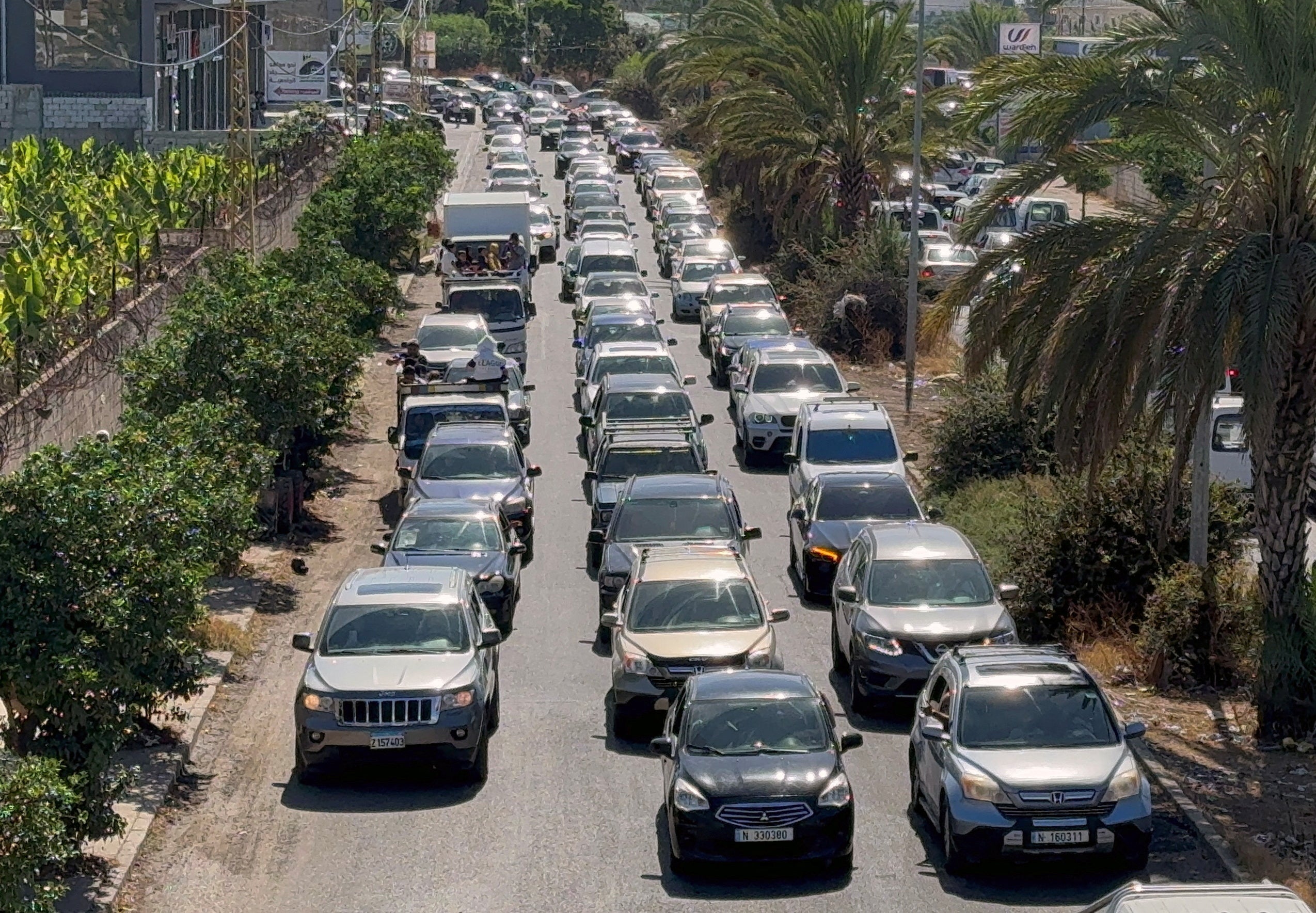 Cars go north from Lebanon’s southern coastal city Sidon as some Lebanese flee heavy Israeli bombardment, Lebanon 23 September 2024