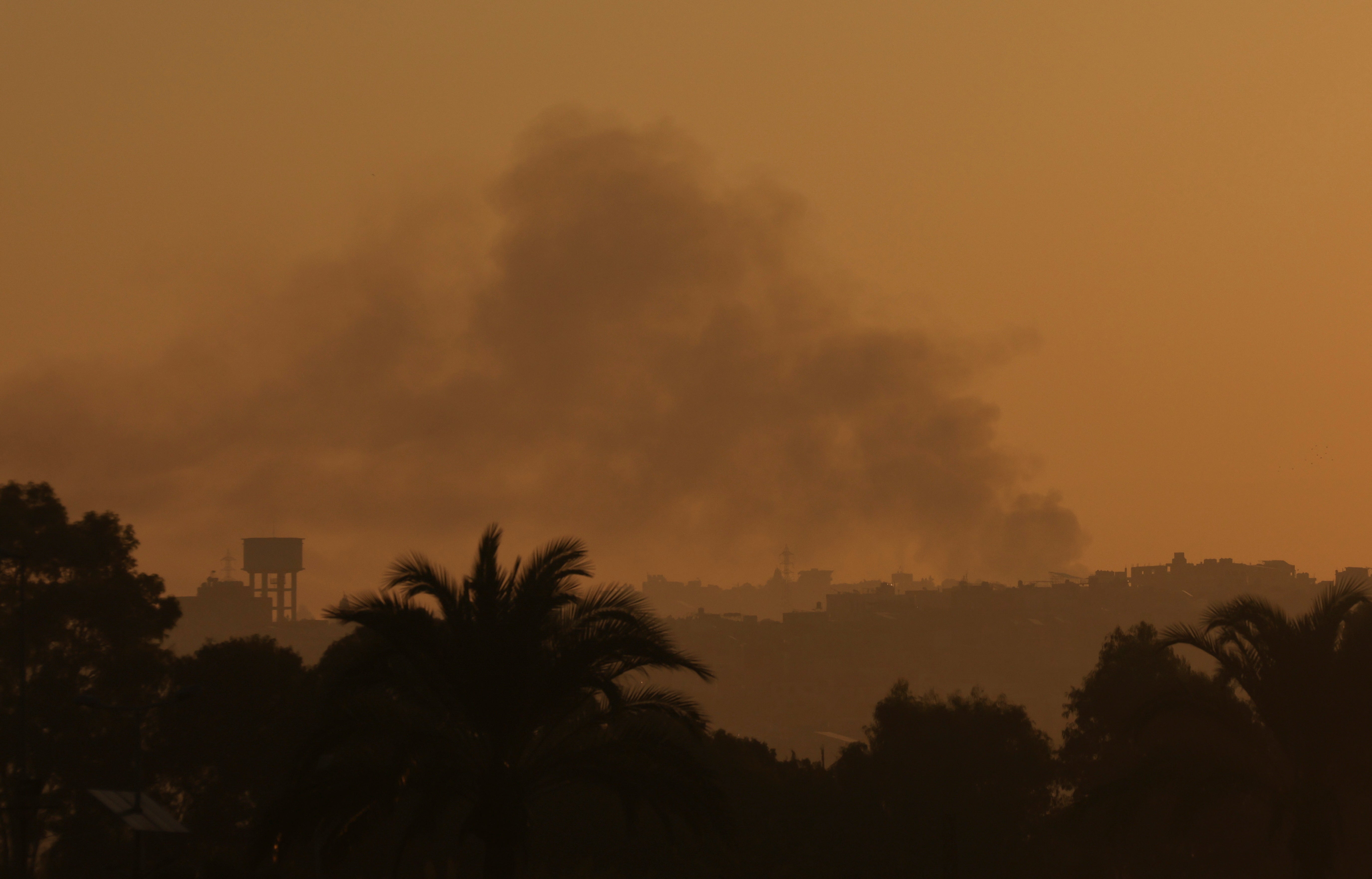 Smoke billows over southern Lebanon following Israeli strikes, amid ongoing cross-border hostilities between Hezbollah and Israeli forces, as seen from Tyre