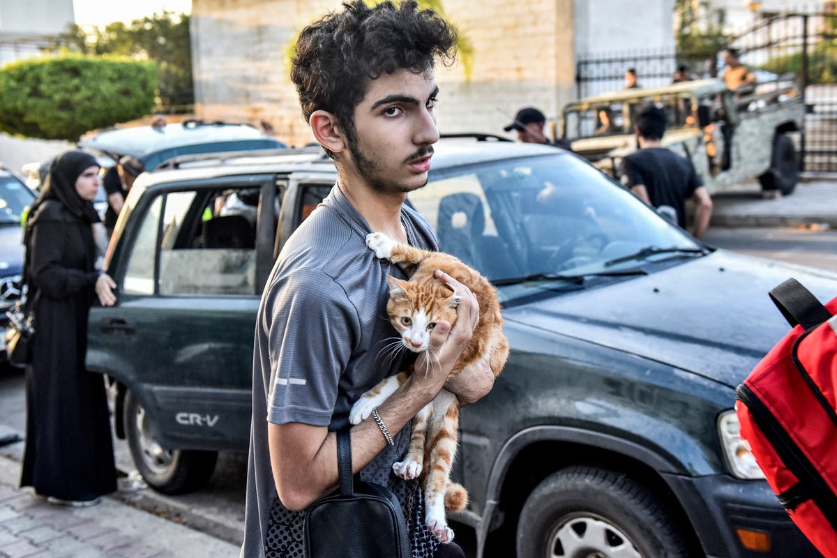 Israel launches new strikes on Hezbollah in Lebanon as thousands flee homes — live