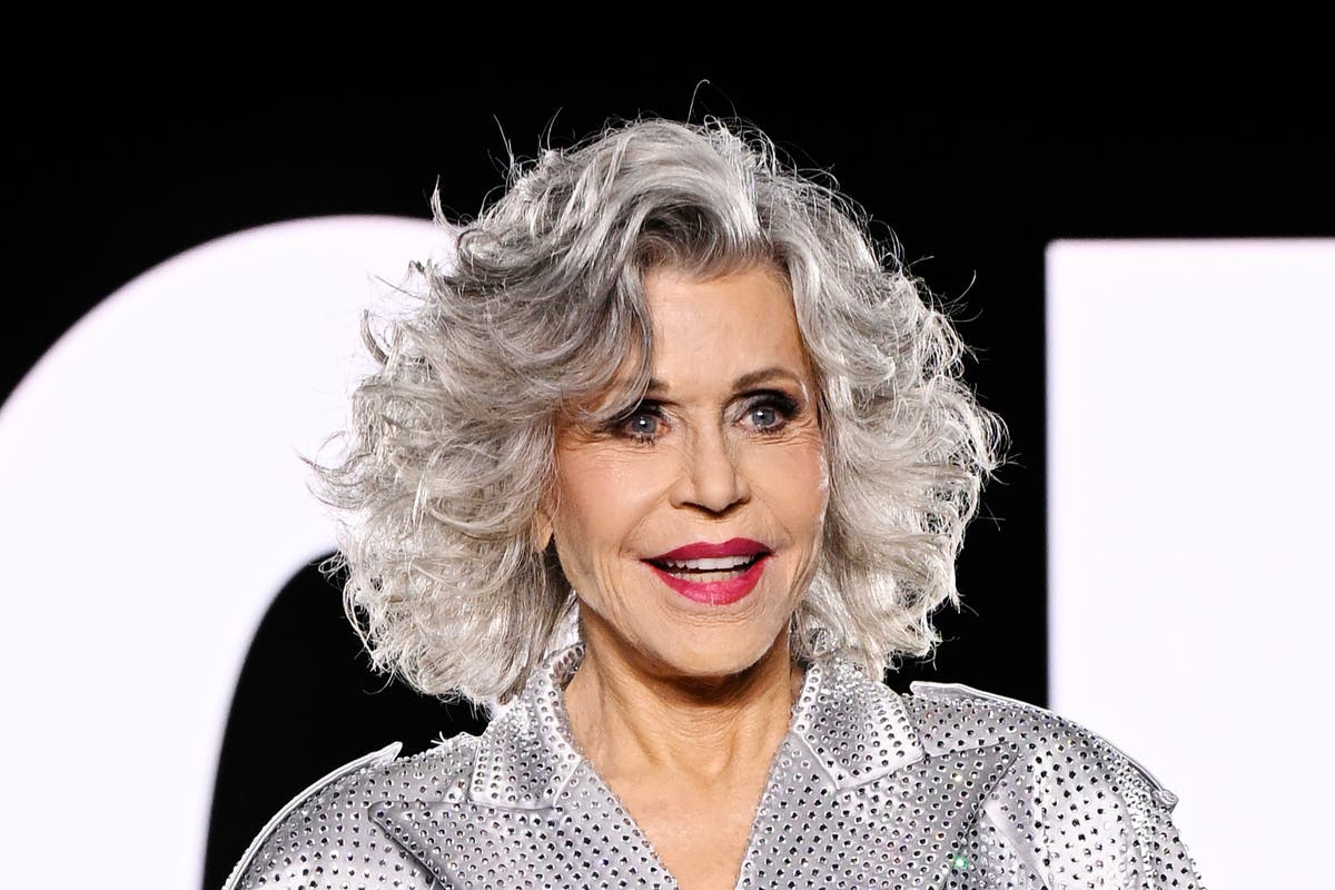 Jane Fonda appears on Paris Fashion Week runway sporting luscious grey locks