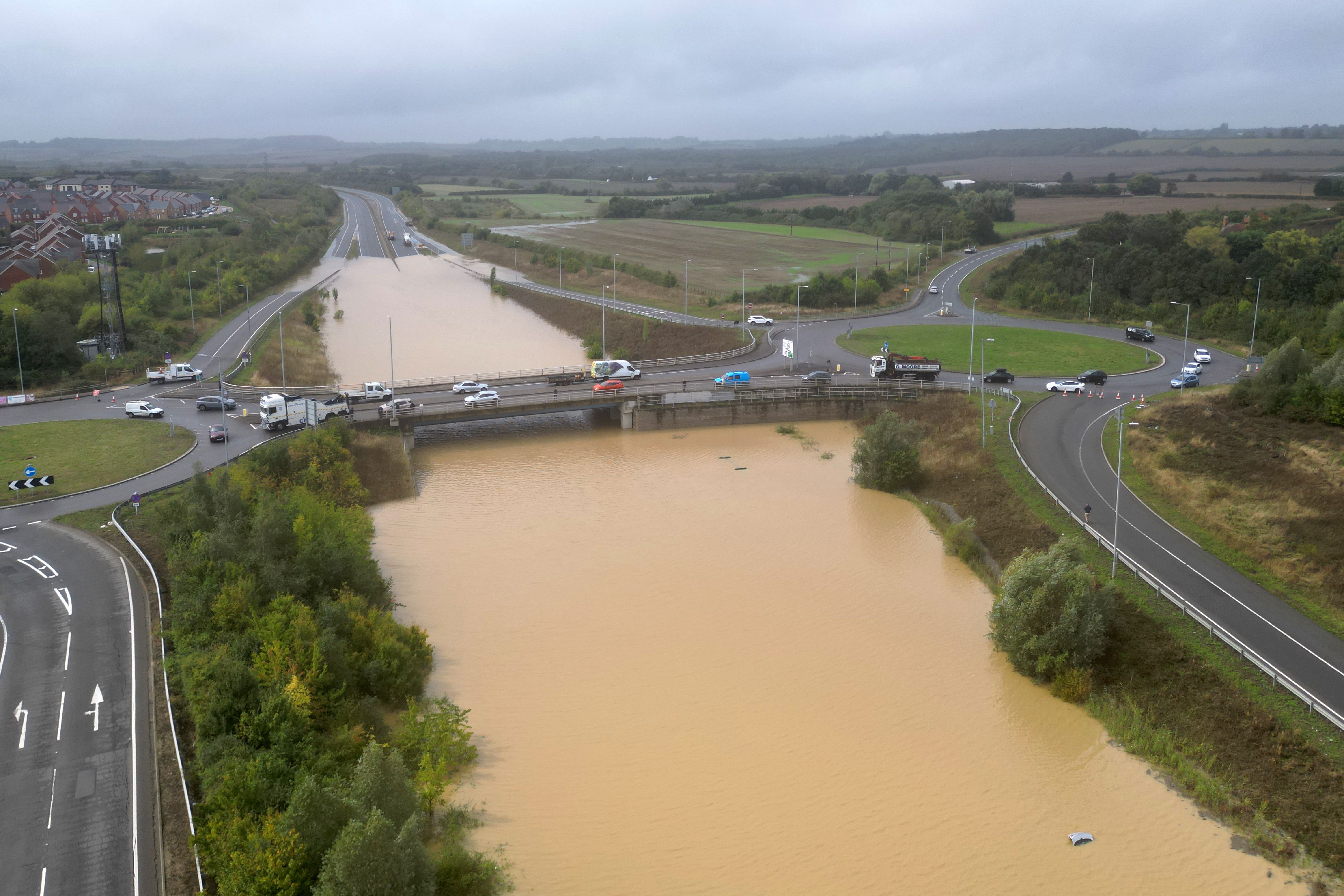 A vehicle was submerged in flood water on the A421 in Marston Moretaine, Bedfordshire (Joe Giddens/PA)