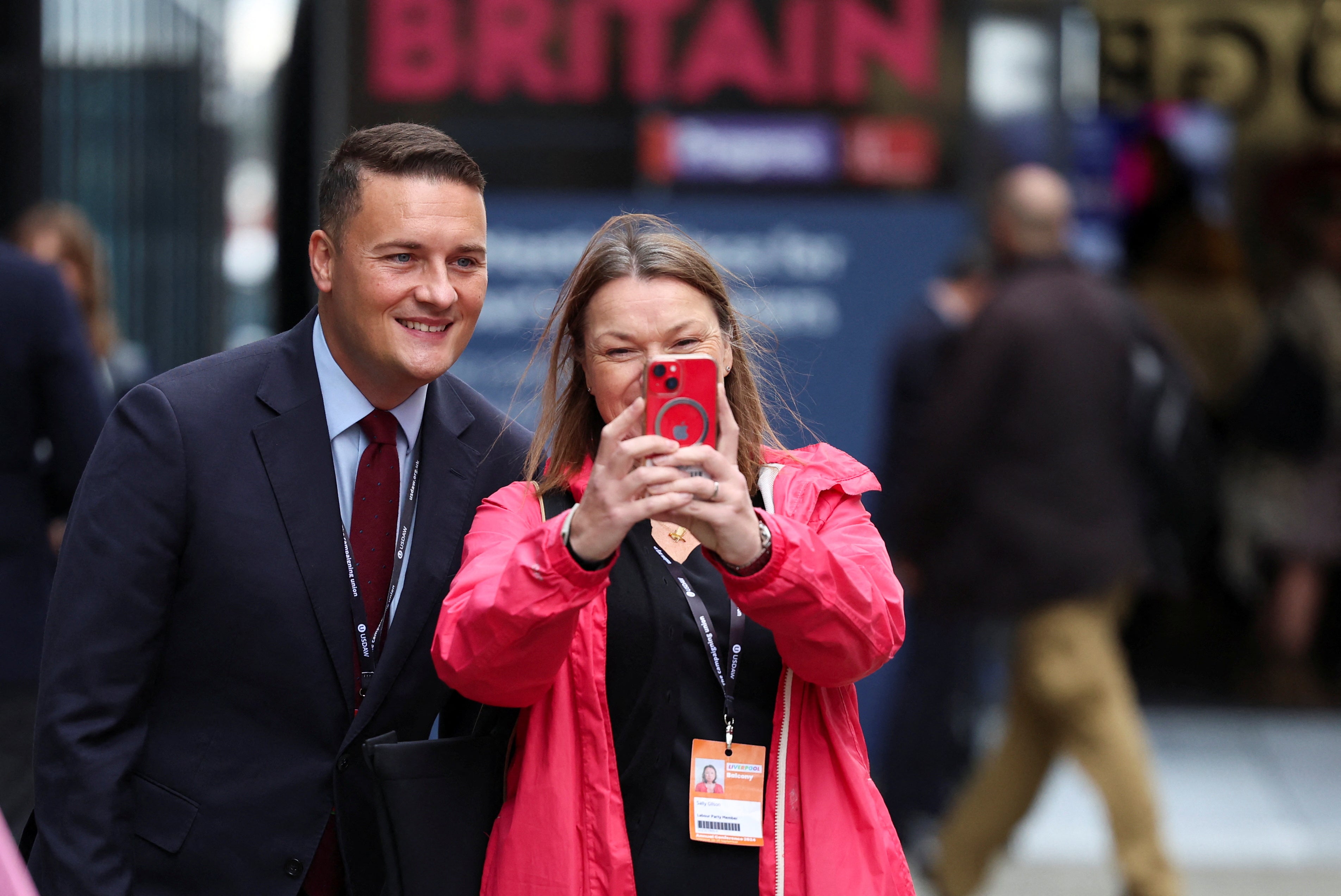 Wes Streeting poses for a selfie with a delegate, outside the conference centre