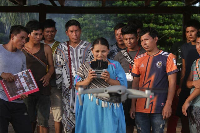 <p>Members of Indigenous communities in Peru use drones to monitor and fight fires threatening the rainforest through a partnership between climate charity Cool Earth and a native organization </p>