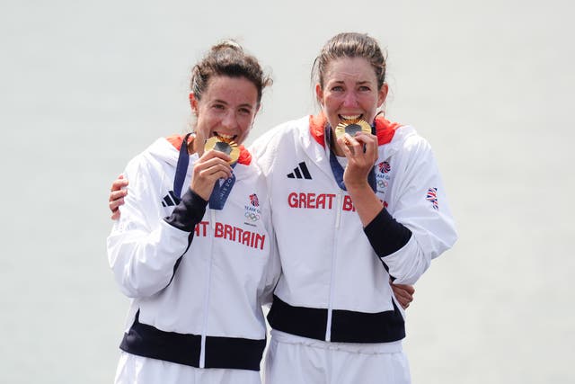 Great Britain’s Emily Craig and Imogen Grant celebrate with their gold medals during the ceremony for the Rowing Lightweight Women’s Double Sculls Finals at the Vaires-sur-Marne Nautical Stadium on the seventh day of the 2024 Paris Olympic Games in France. Picture date: Friday August 2, 2024.