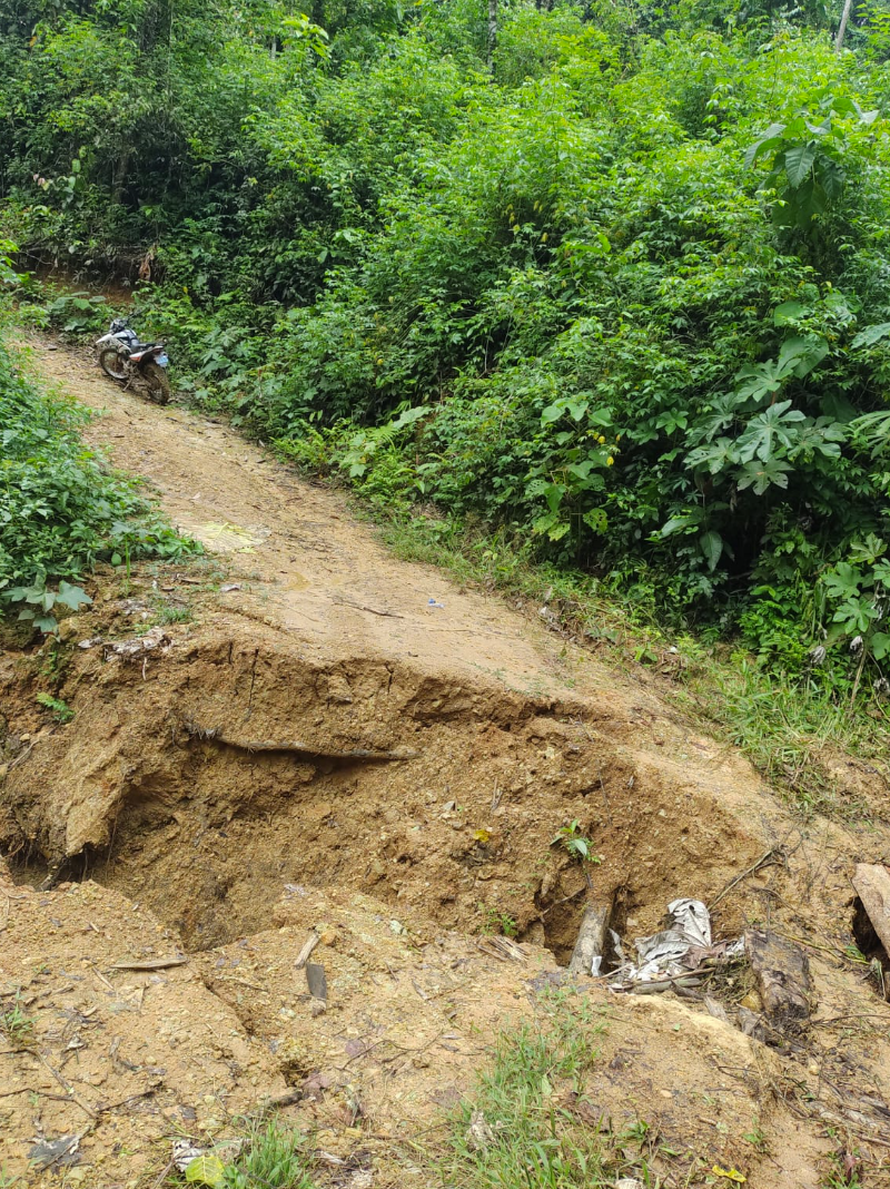 Parijaro, a remote Indigenous community in the Peruvian mountains, can only be reached by this often-inaccessible road, pictured after heavy rains; new tech and training mean that a community leader can now utilize WhatsApp to call for help in cases of emergency sickness, enabling access to medical care by motorbike or even helicopter, rather than an arduous two-day journey