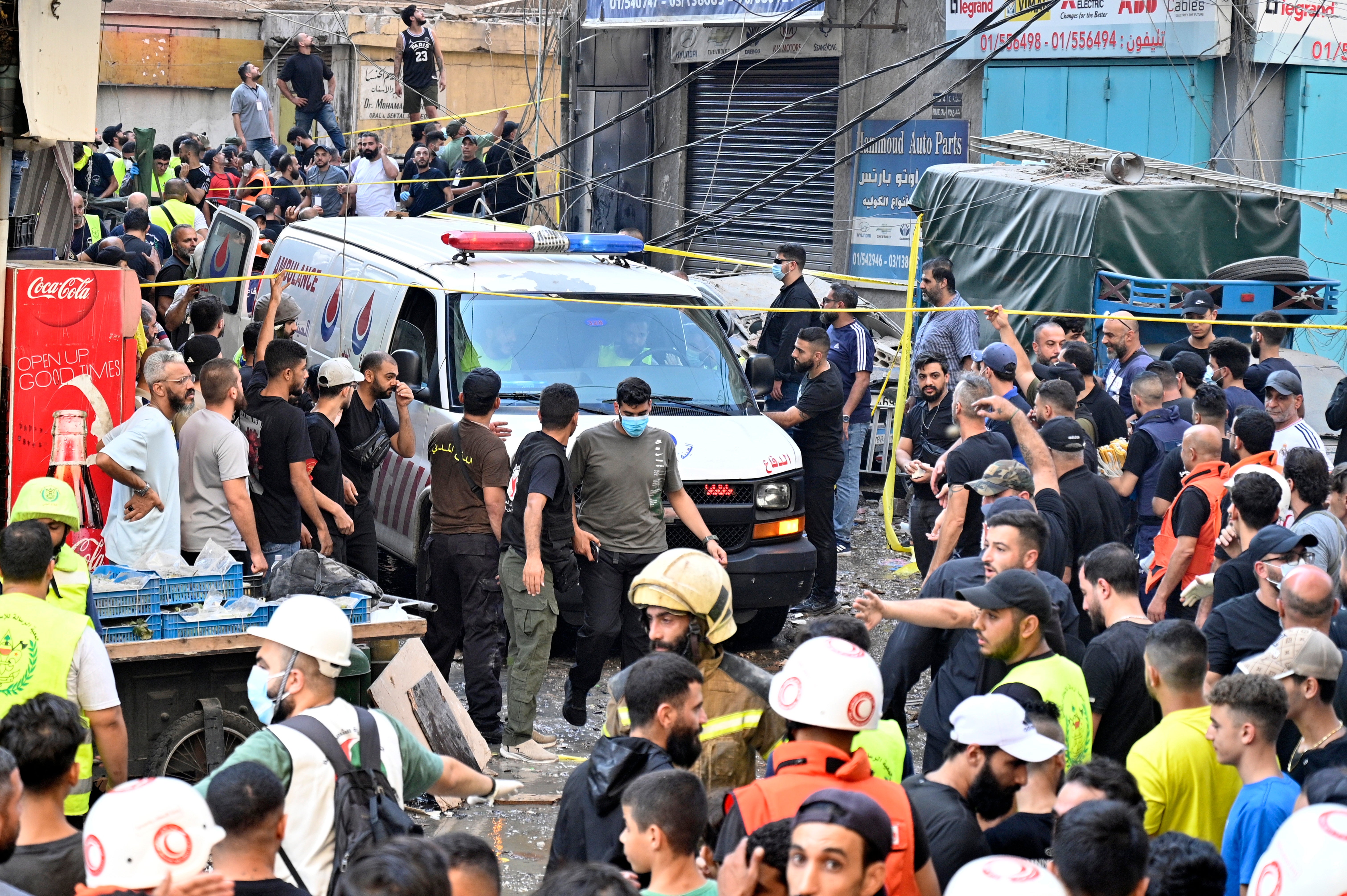 Lebanese authorities gather at the site of an Israeli strike on Beirut