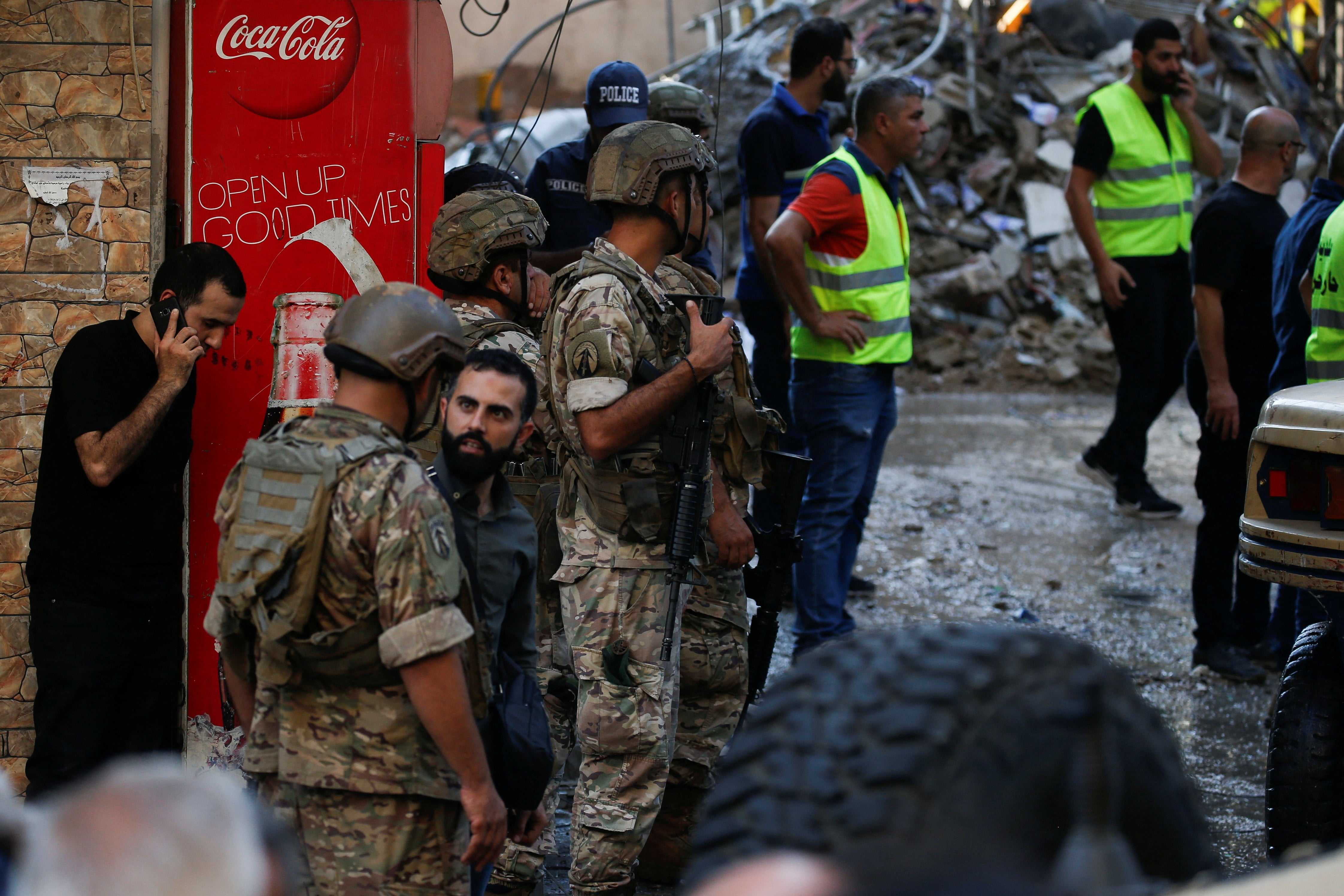 Lebanese soldiers stand by at the site of the strike, said to have killed a Hezbollah commander