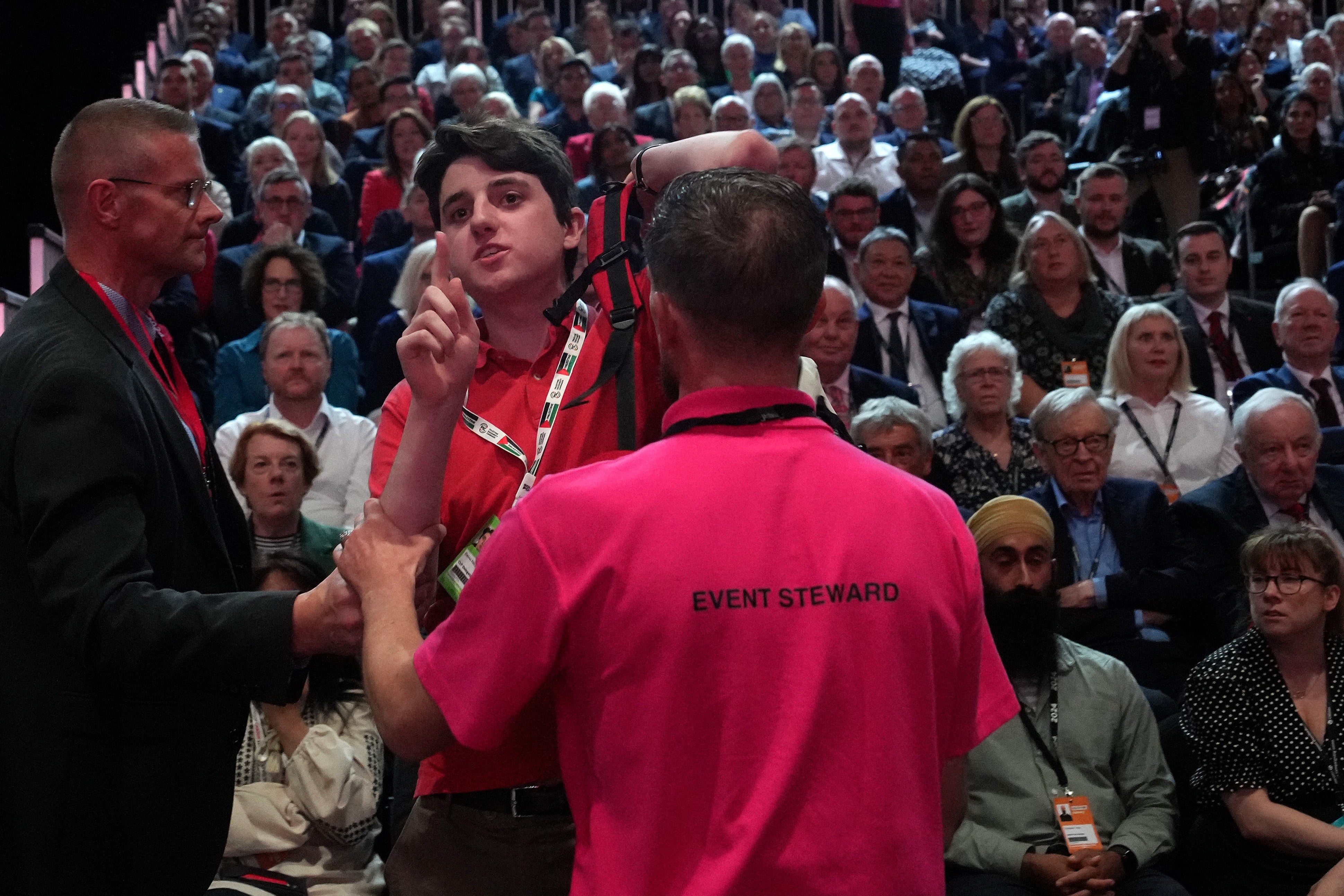 A protester shouts ‘does that include the children of Gaza?’ as Sir Keir Starmer delivers his keynote speech