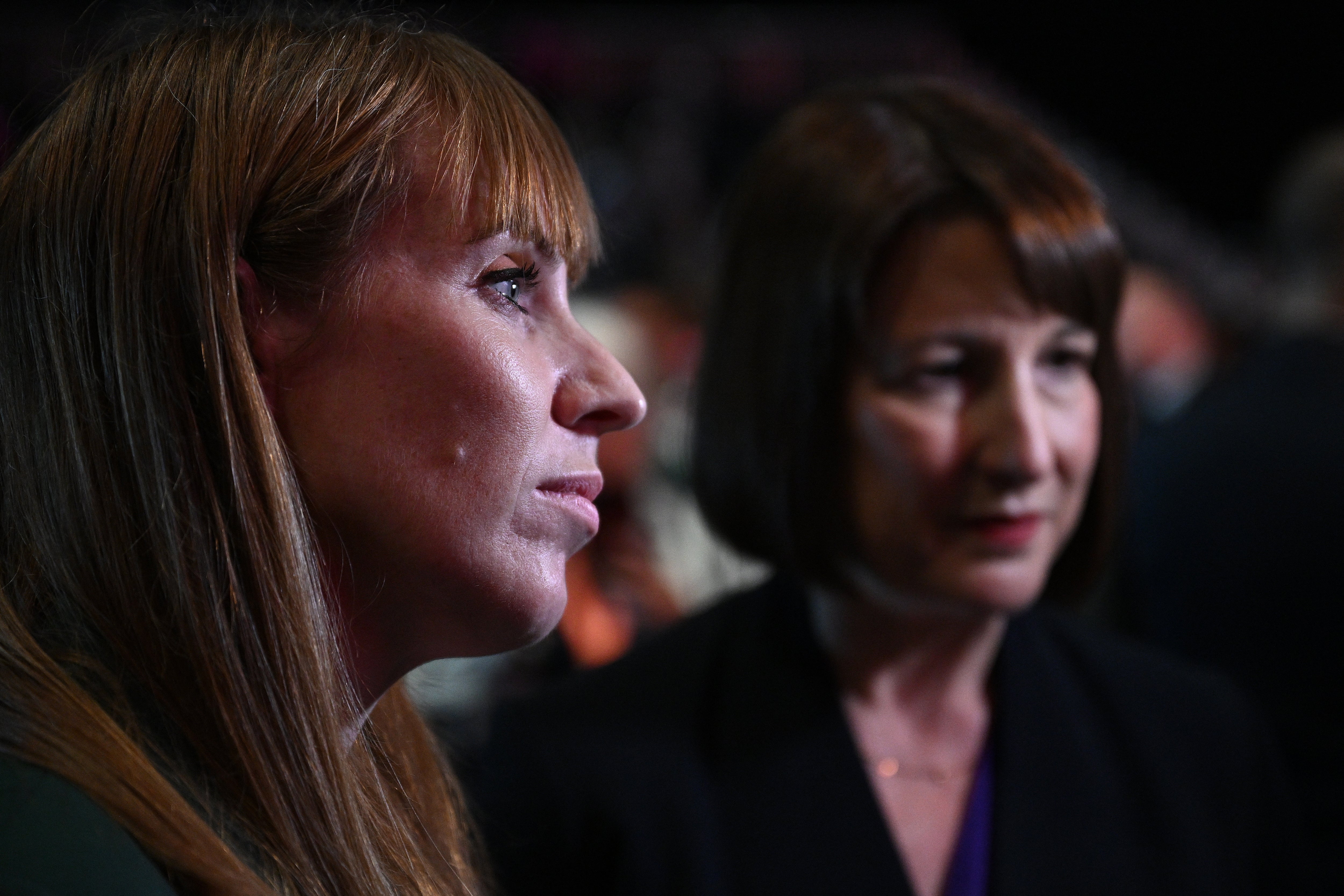 Chancellor of the Exchequer Rachel Reeves (R) and Britain's Deputy Prime Minister and Levelling Up, Housing and Communities Secretary Angela Rayner (L) speak during an interview with a TV journalist after Keir Starmer’s speech