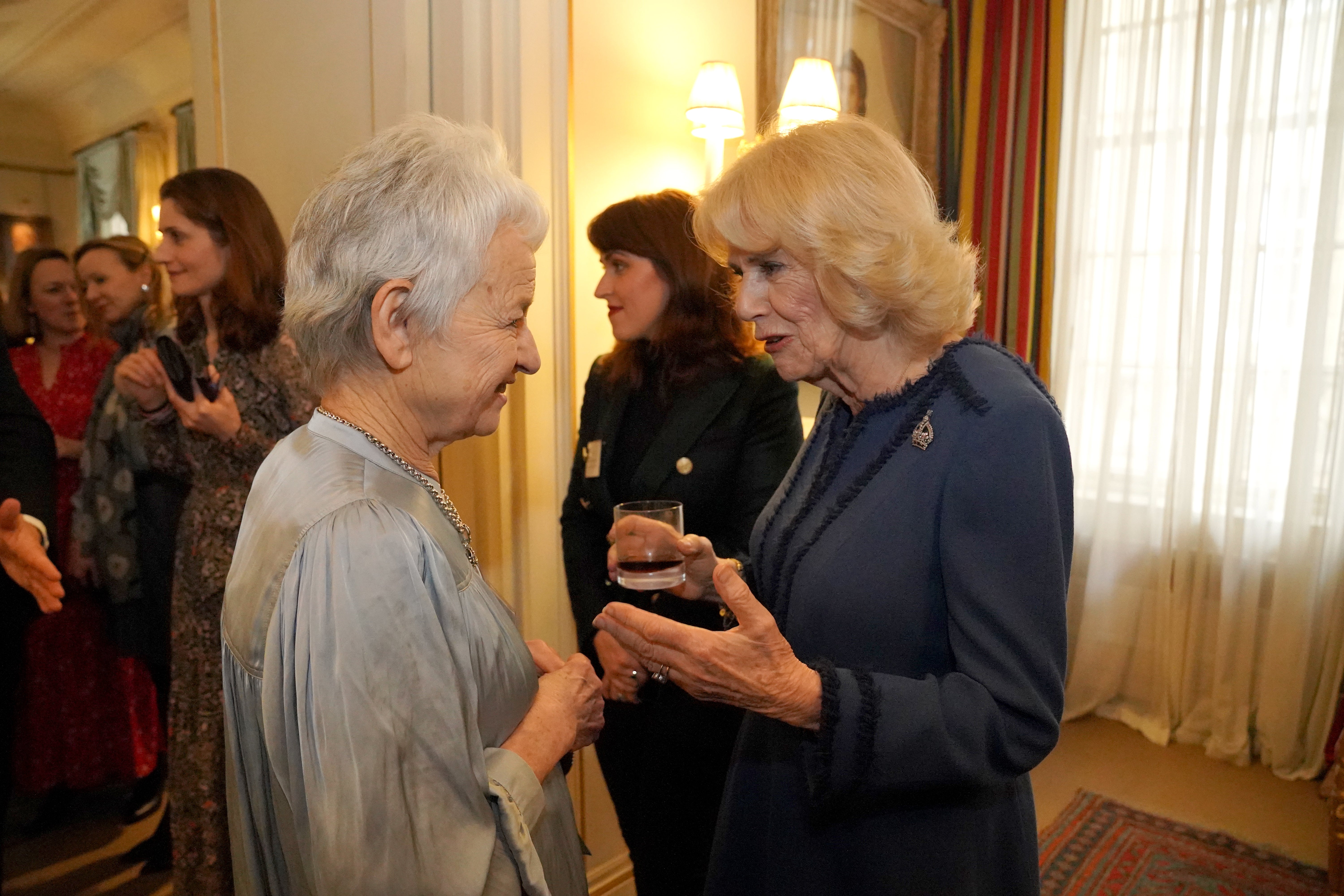 Jacqueline Wilson meets Queen Camilla at a reception for her charity The Reading Room. Wilson was made a dame in 2008