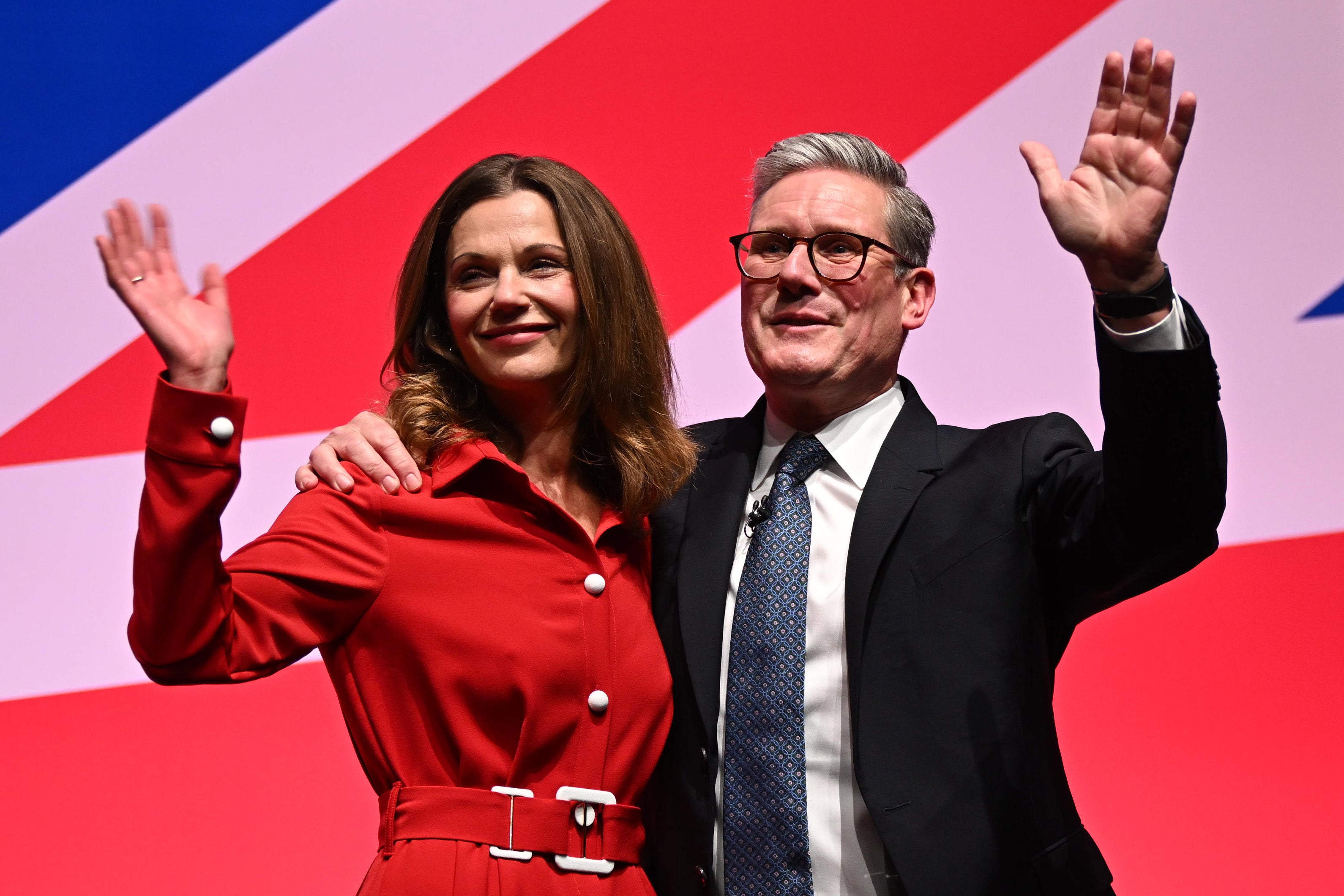 Keir Starmer and his wife Victoria acknowledge cheers after his conference speech in Liverpool