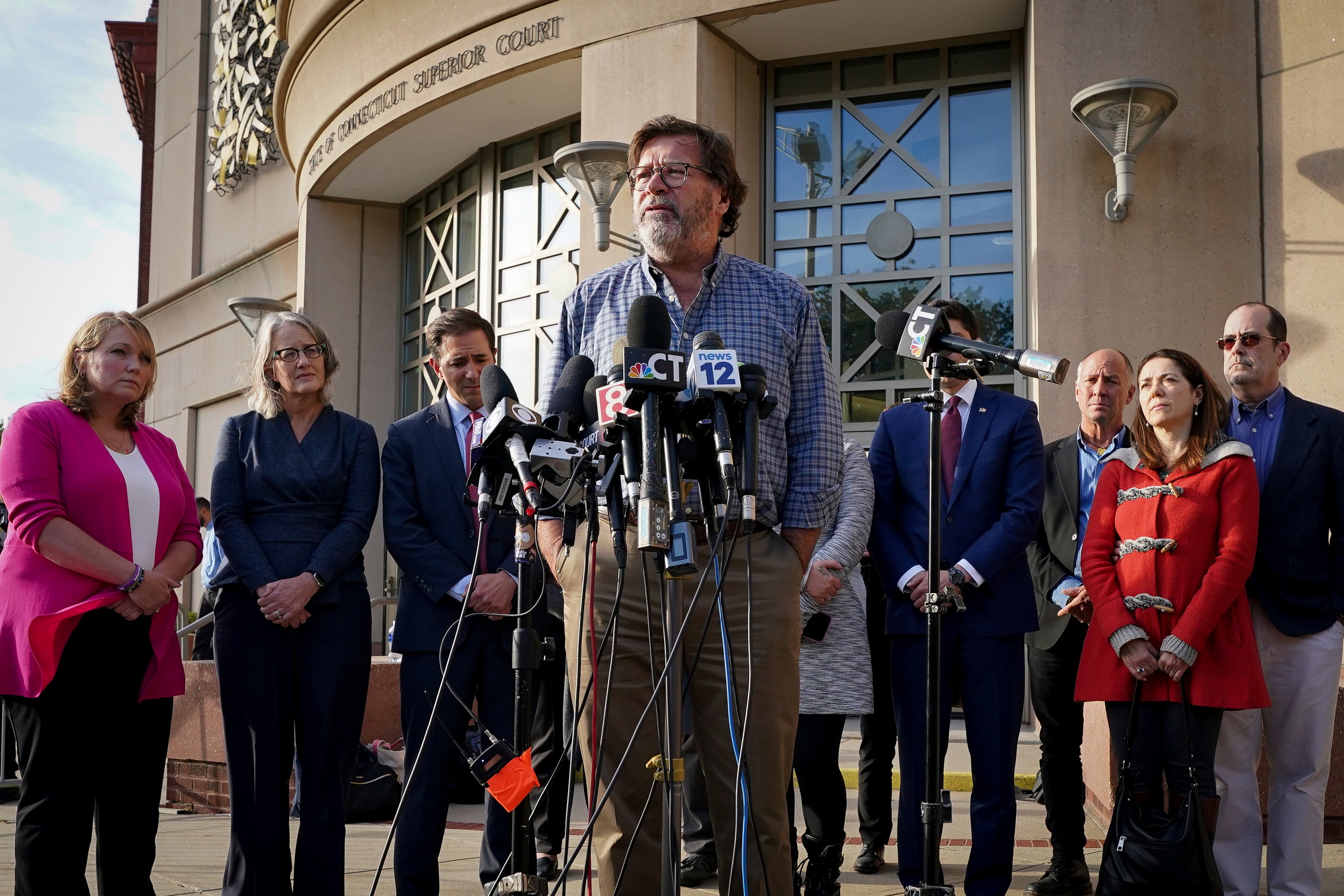 Bill Sherlach, husband of Mary, one of the Sandy Hook School shooting victims, speaks to the media after jurors returned a $965 million dollar judgement in the defamation trial against Alex Jones.