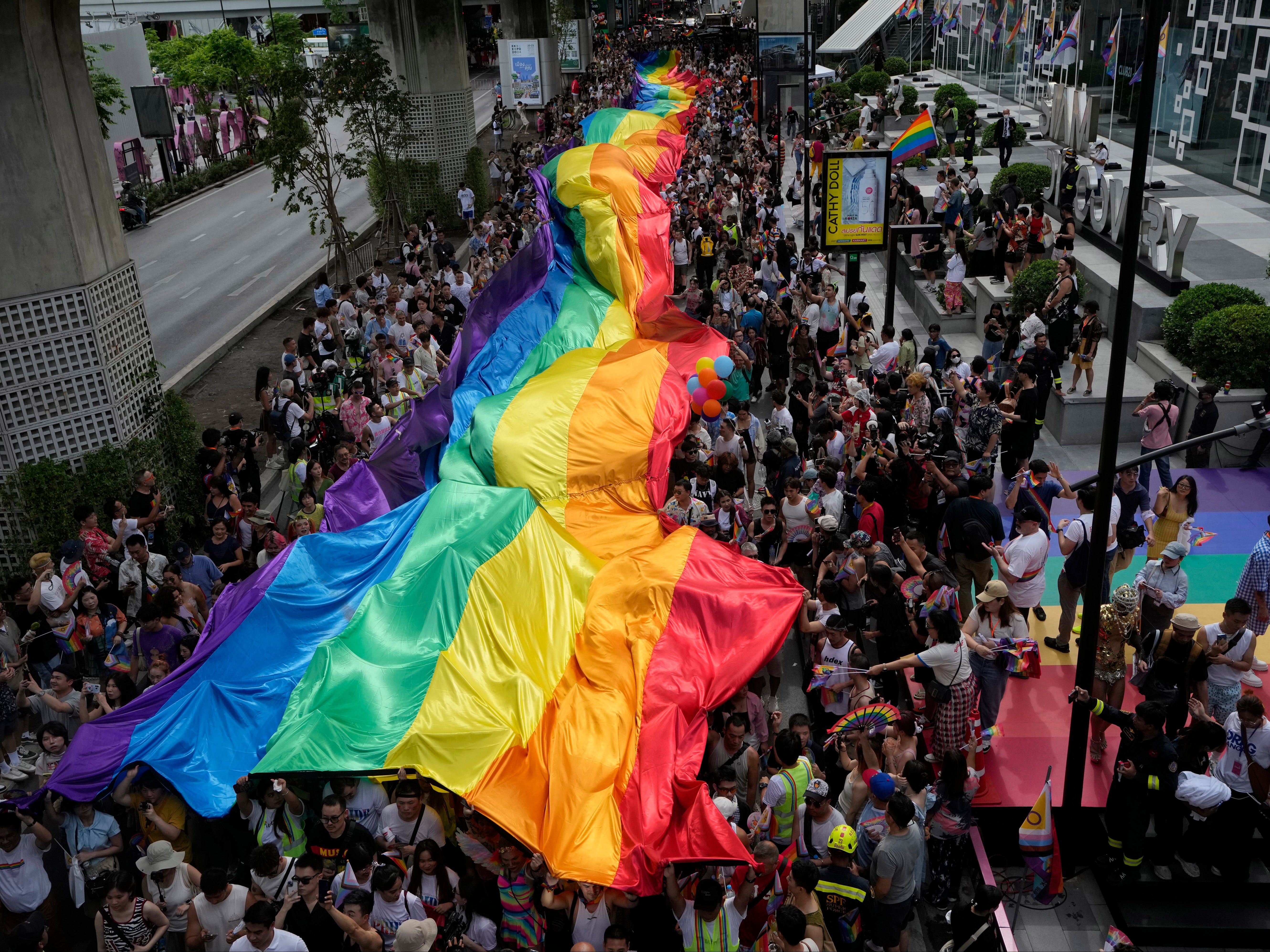 <p>File: Participants hold a rainbow flag during the Pride Parade in Bangkok, Thailand, on 1 June 2024</p>