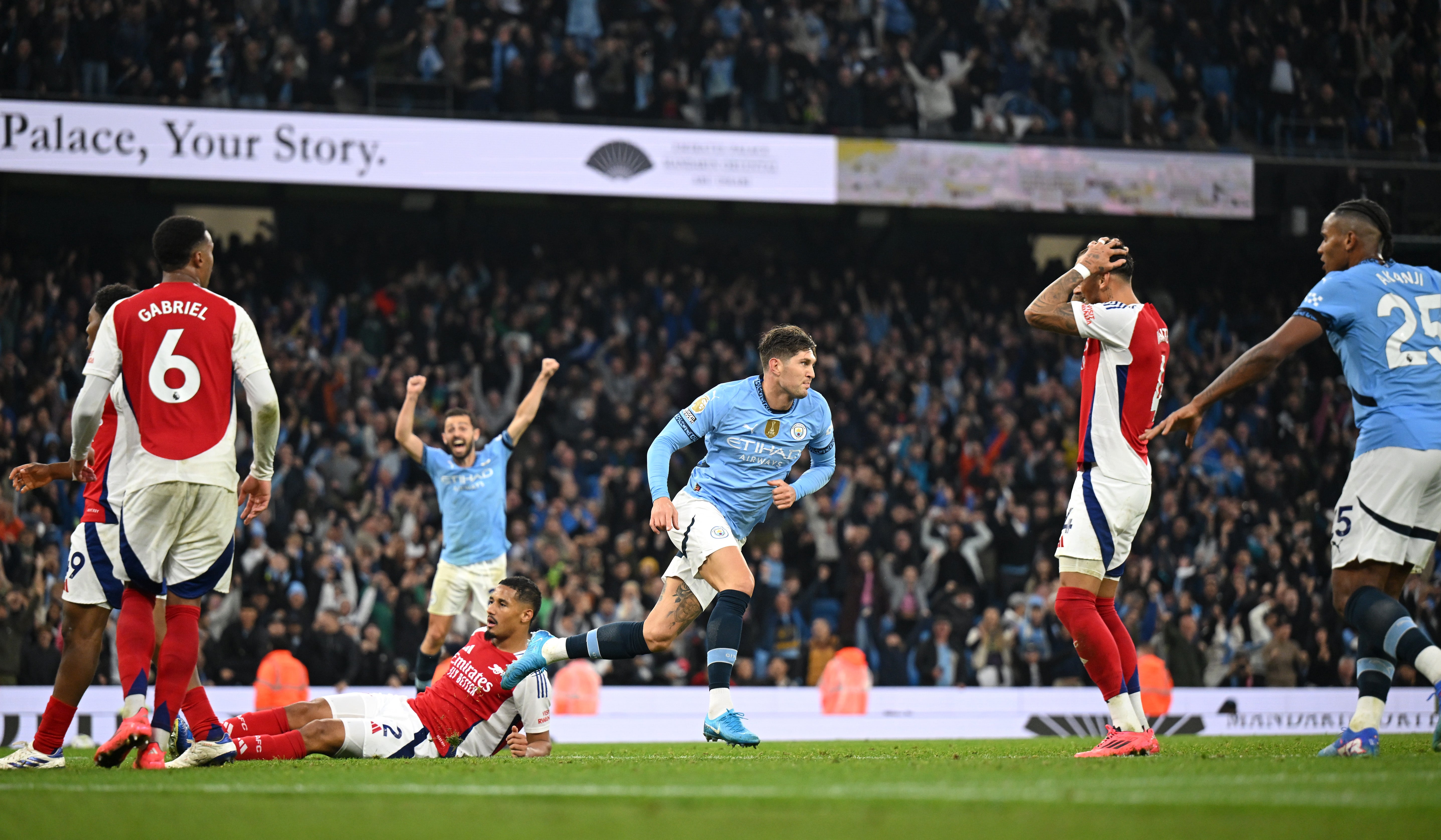 John Stones of Manchester City celebrates his late equaliser against Arsenal