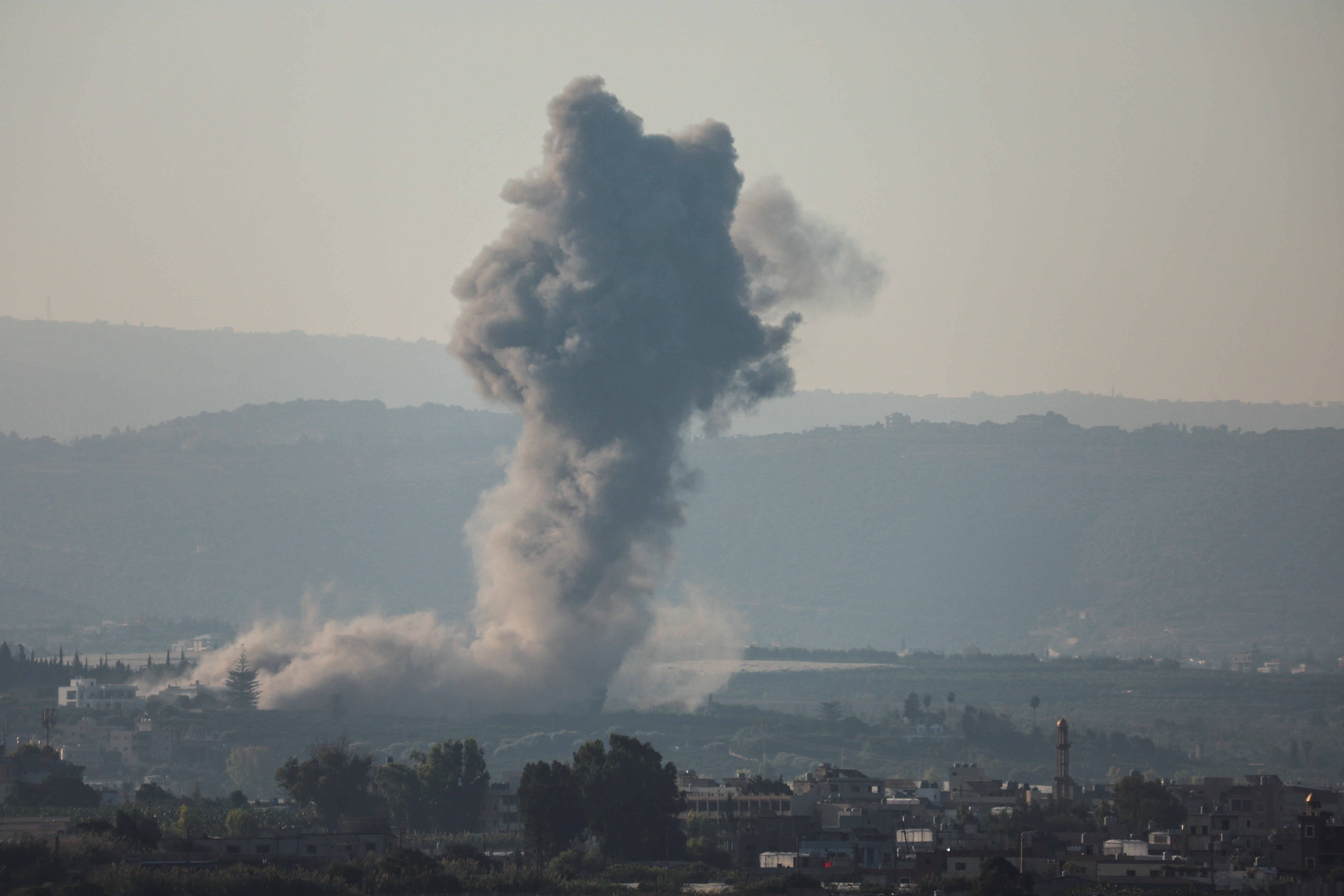 Smoke billows over southern Lebanon following an Israeli strike, amid ongoing cross-border hostilities between Hezbollah and Israeli forces, as seen from Tyre, Lebanon