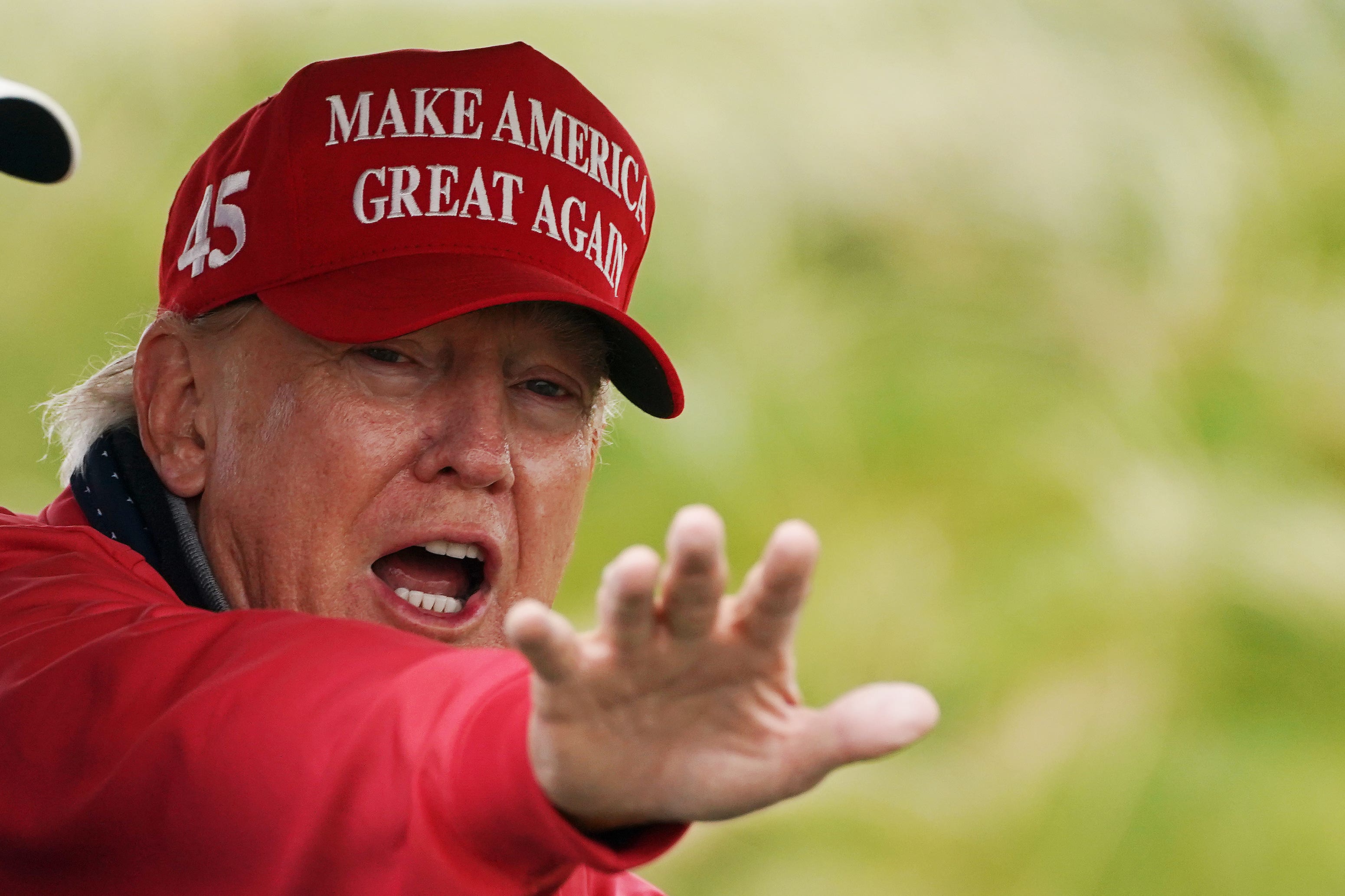 Former US president Donald Trump on the golf course (Brian Lawless/PA)