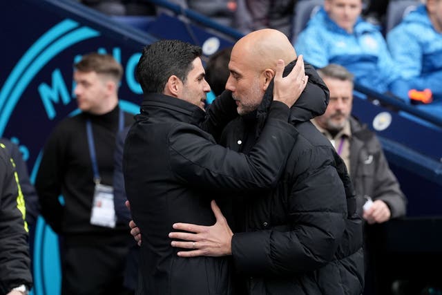 Pep Guardiola (right) insists he still has a good relationship with Mikel Arteta (Martin Rickett/PA)