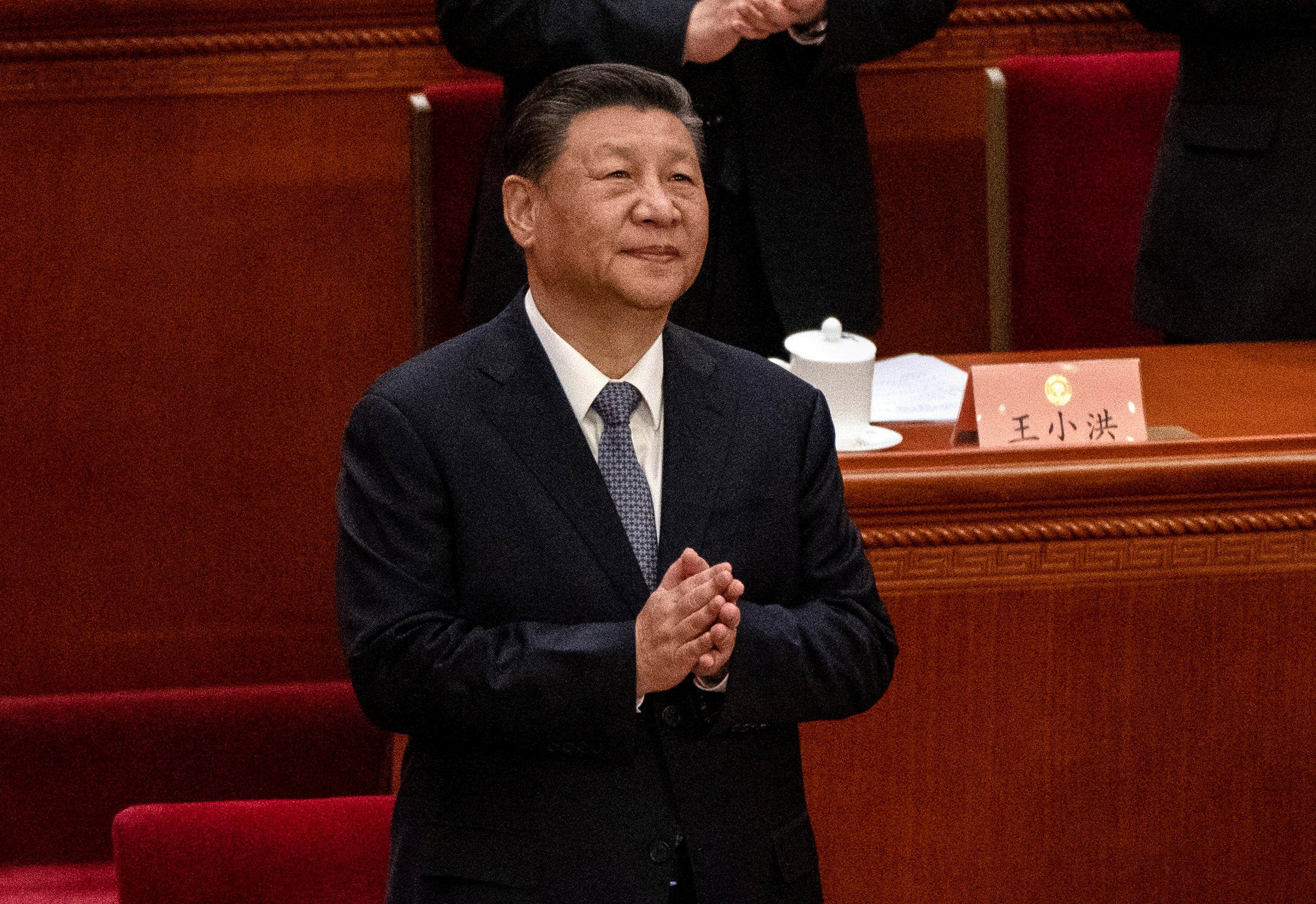 <p>File: Chinese president Xi Jinping clasps his hands as he stands at the opening session of the CPPCC, or Chinese Peoples Political Consultative Conference</p>