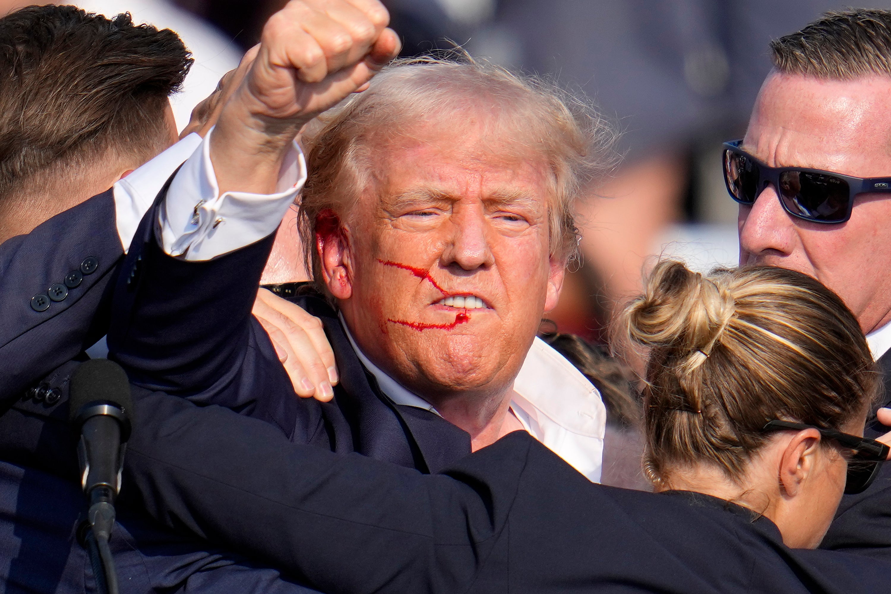 Trump raised his fist in the air after surviving the assassination attempt in Butler