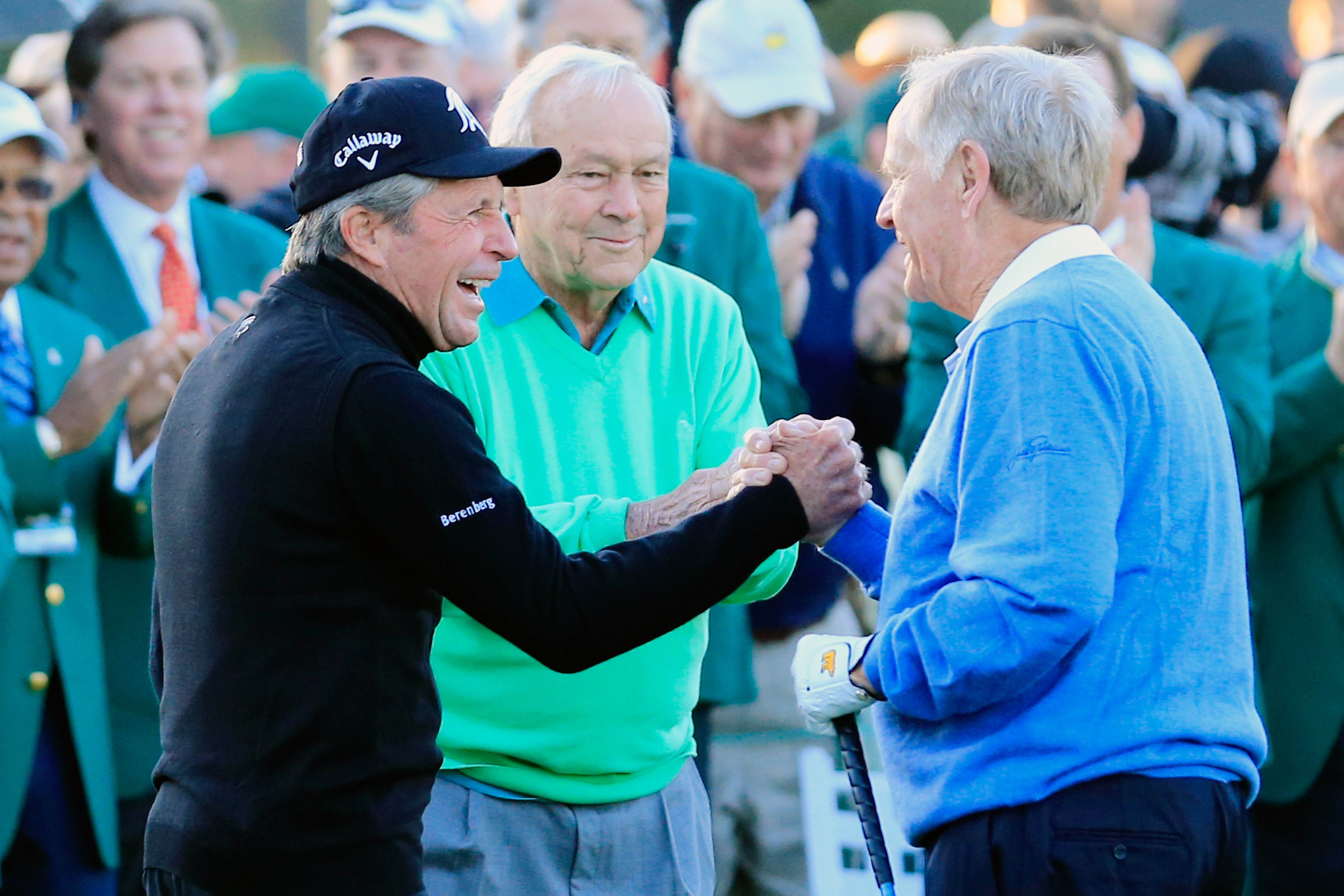 Arnold Palmer (center) was one of professional golf’s most beloved players