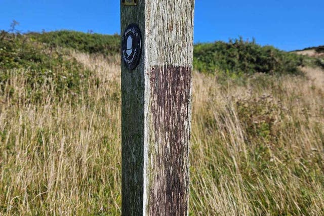 A signpost at Seven Sisters with the plaque missing (Sussex Police/PA)