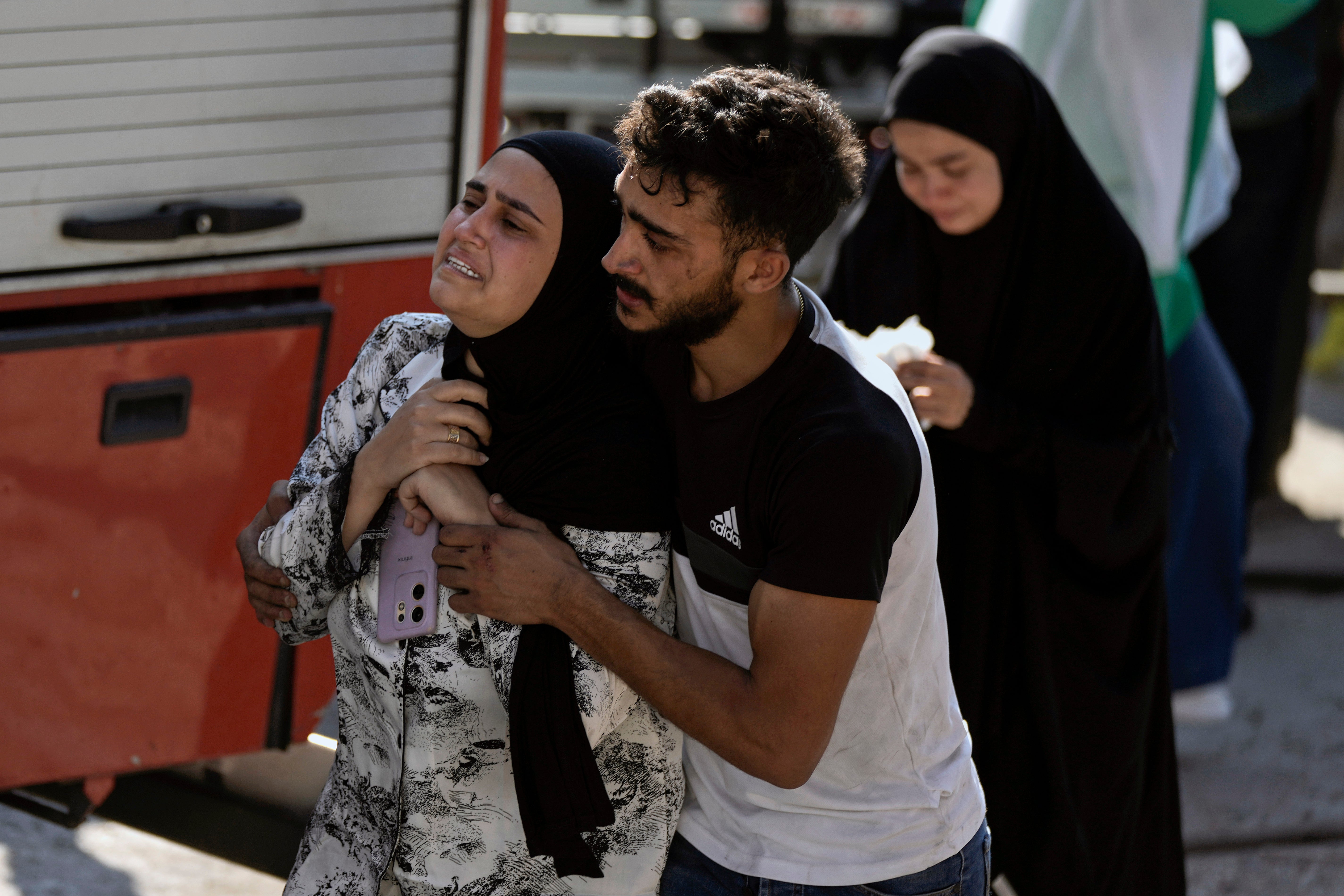 A woman reacts at the scene of an Israeli airstrike in the town of Maisara, north of Beirut