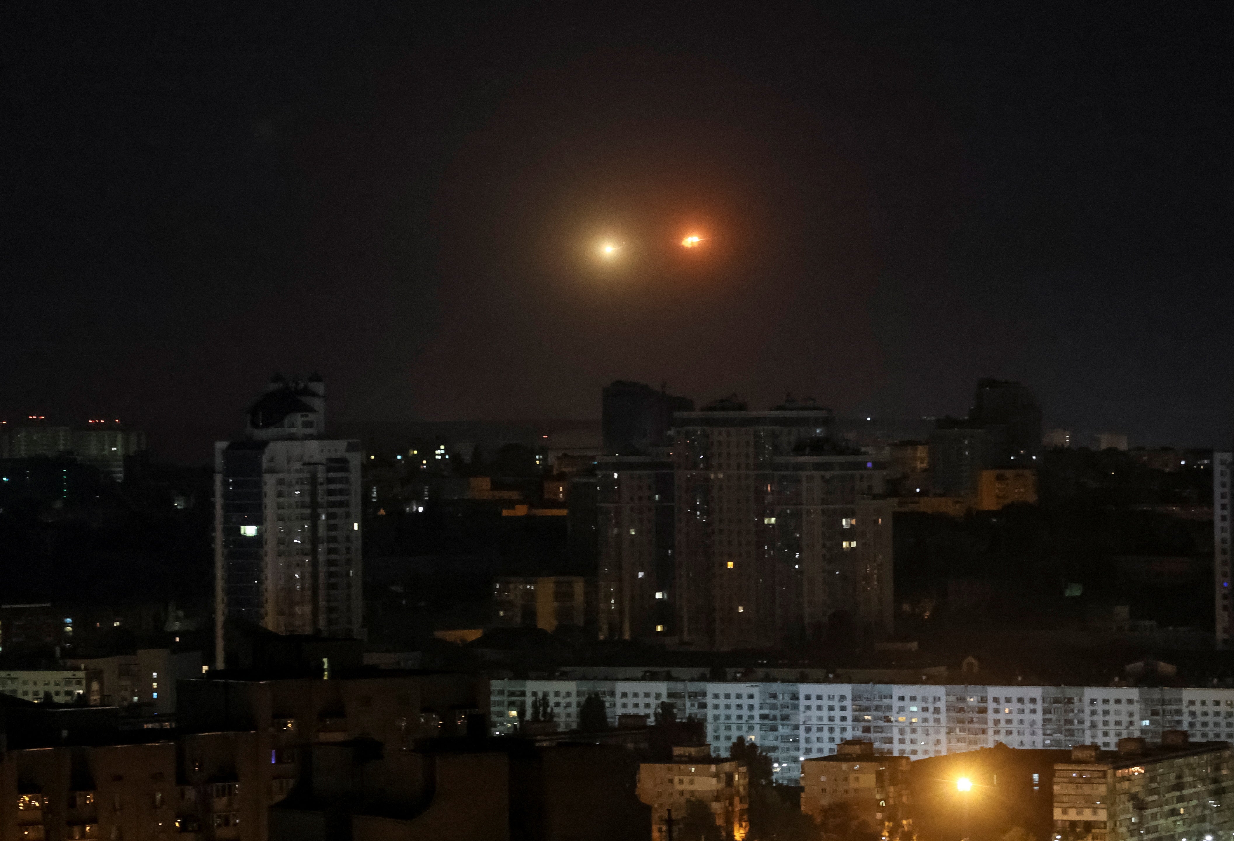 An explosion of a drone is seen in the sky over the city during a Russian drone strike, amid Russia's attack on Ukraine, in Kyiv, Ukraine