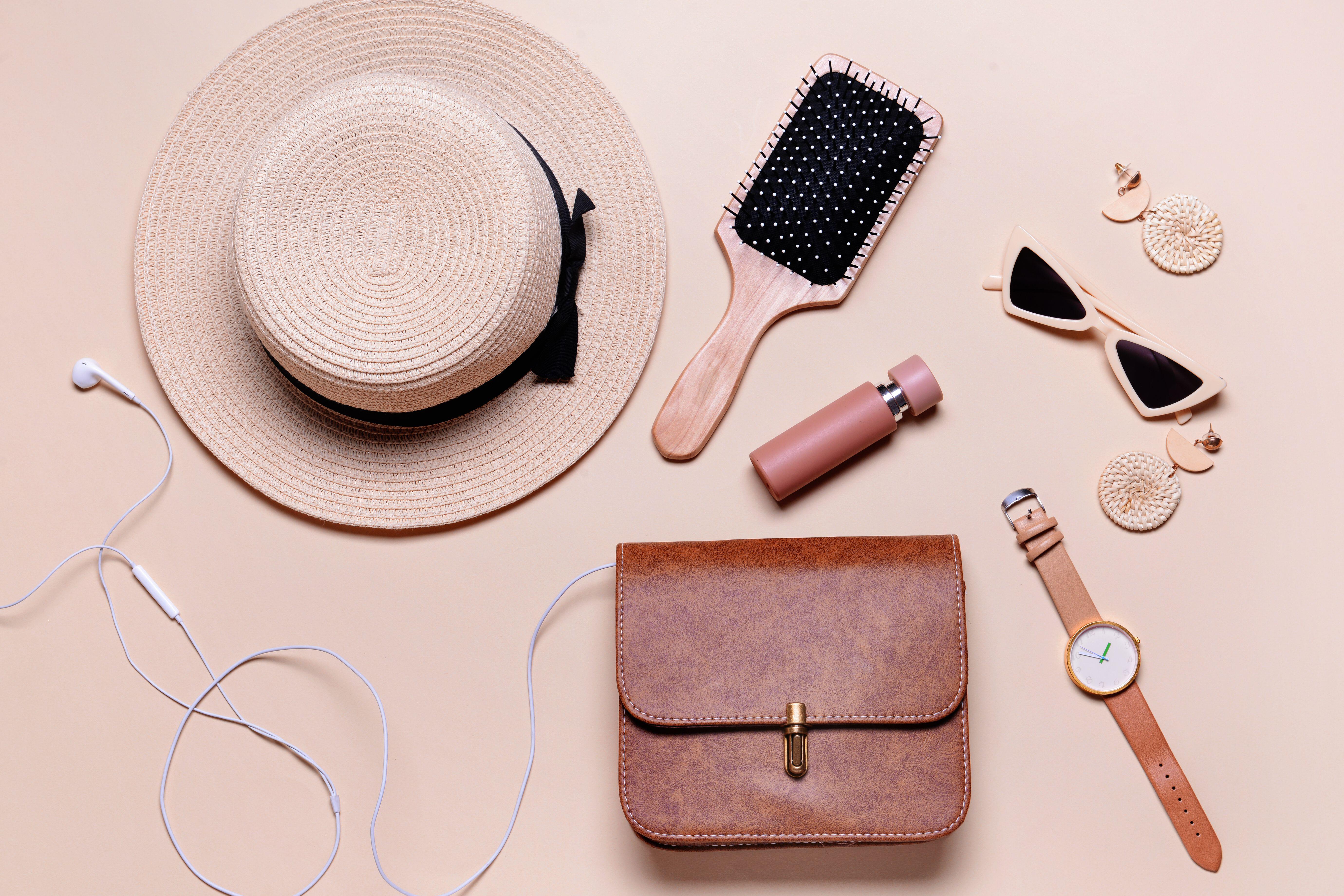 Hairbrushes can cause tugging and damage of your handbag’s lining (Alamy/PA)