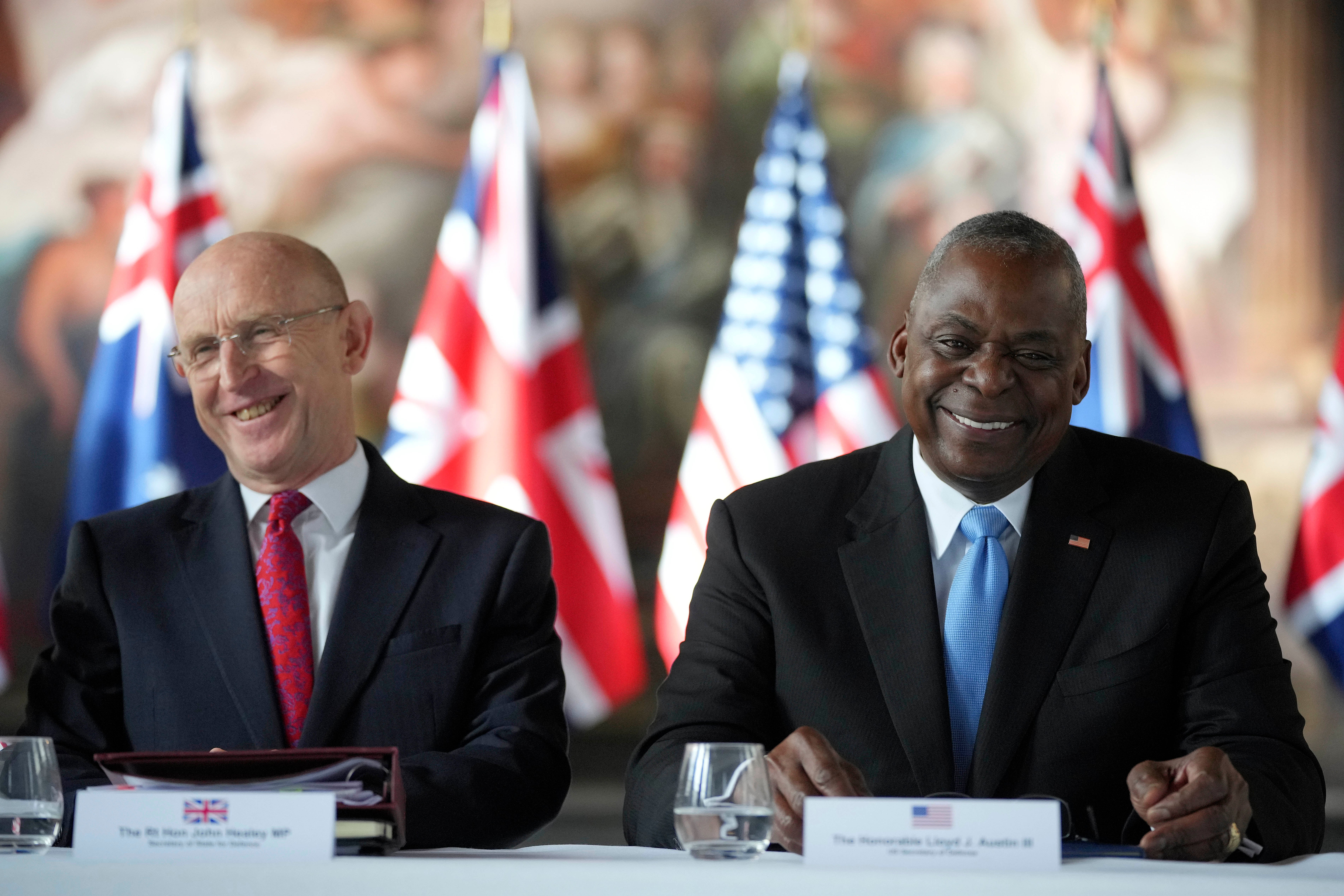 UK defense secretary John Healey and US Secretary of defense Lloyd Austin sit together