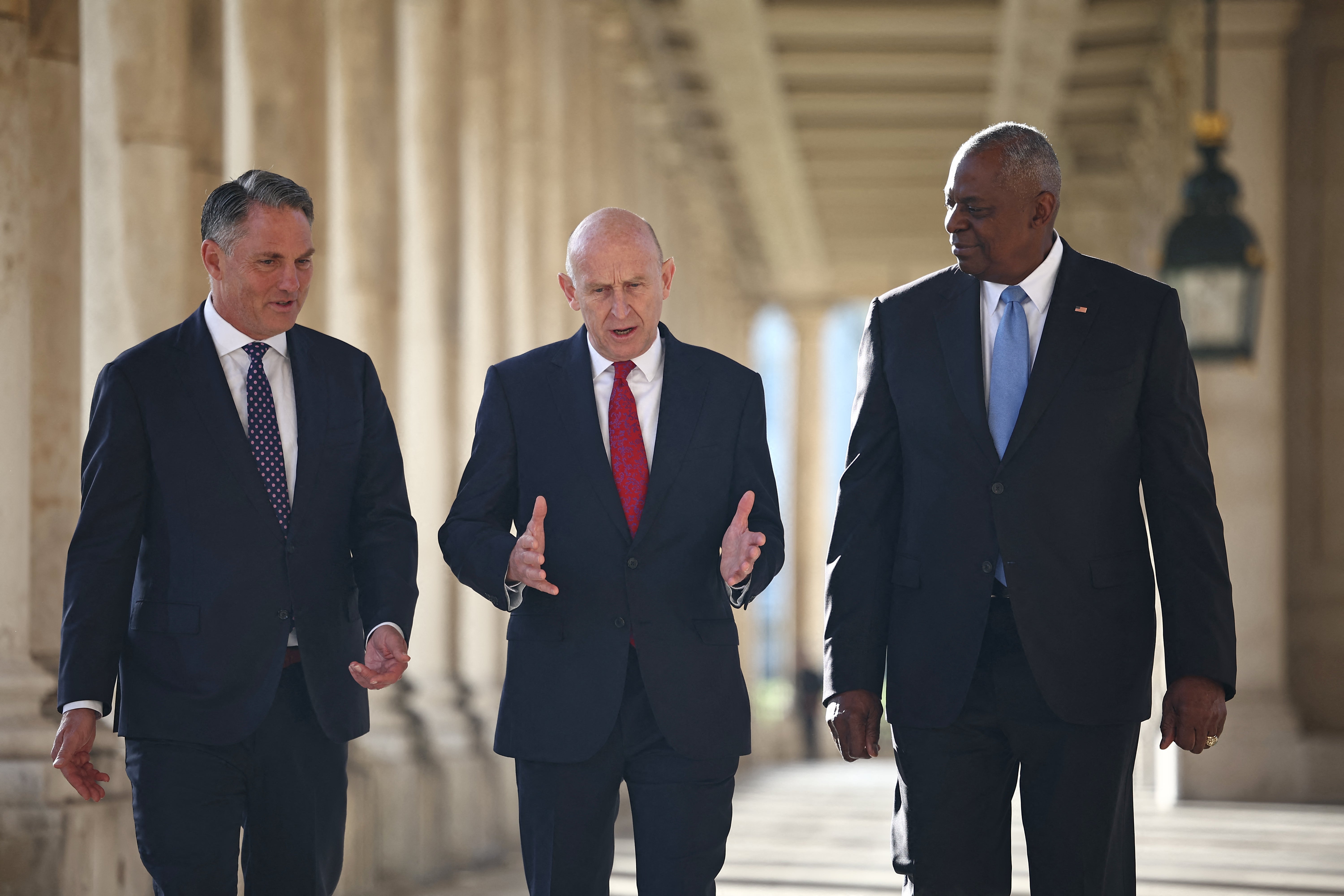 Australian Defense Minister Richard Marles, John Healey and US defense secretary Lloyd Austin talk ahead of the AUKUS defense ministerial meeting in London