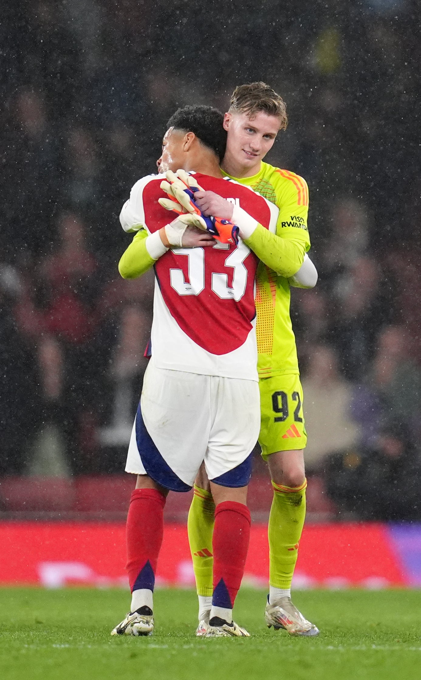 Sixteen-year-old Jack Porter, hugging Ethan Nwaneri at the final whistle, was handed his debut (John Walton/PA)