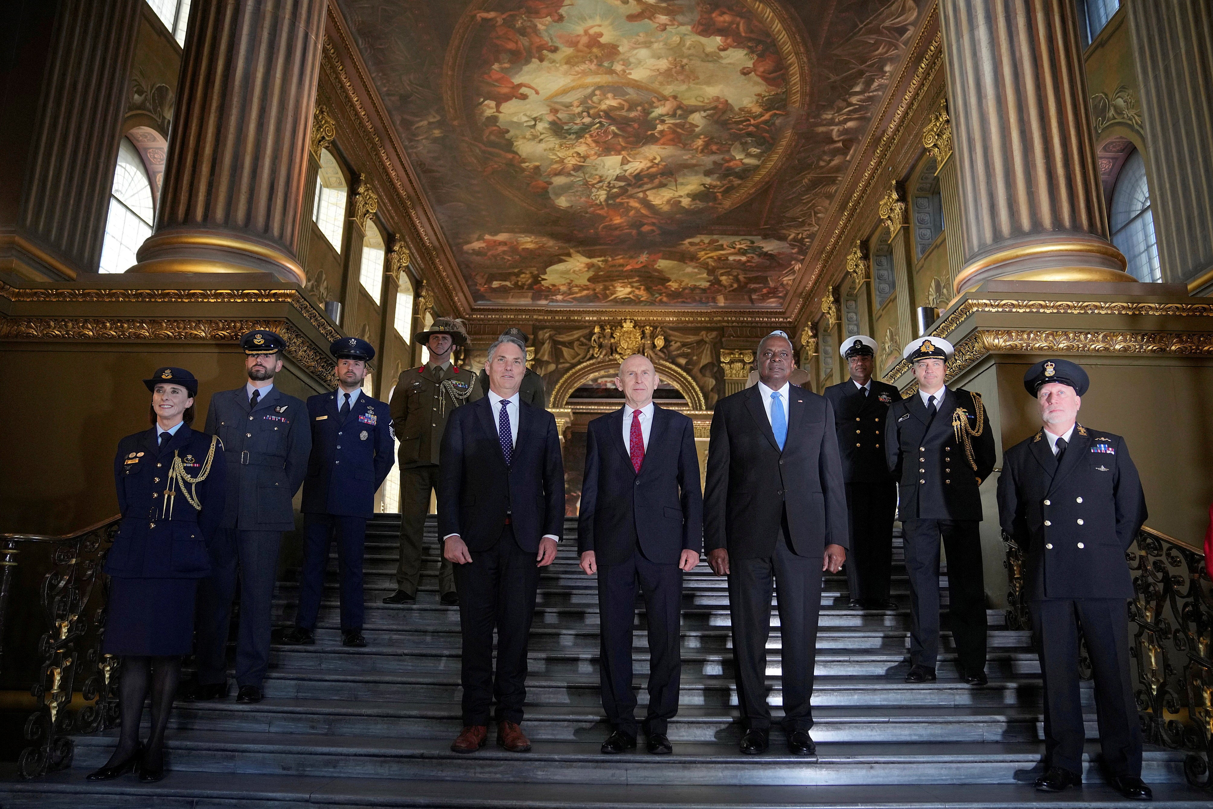 John Healey, US secretary of defense Lloyd Austin, and Australian defense minister Richard Marles pose at the Old Royal Naval College, Greenwich