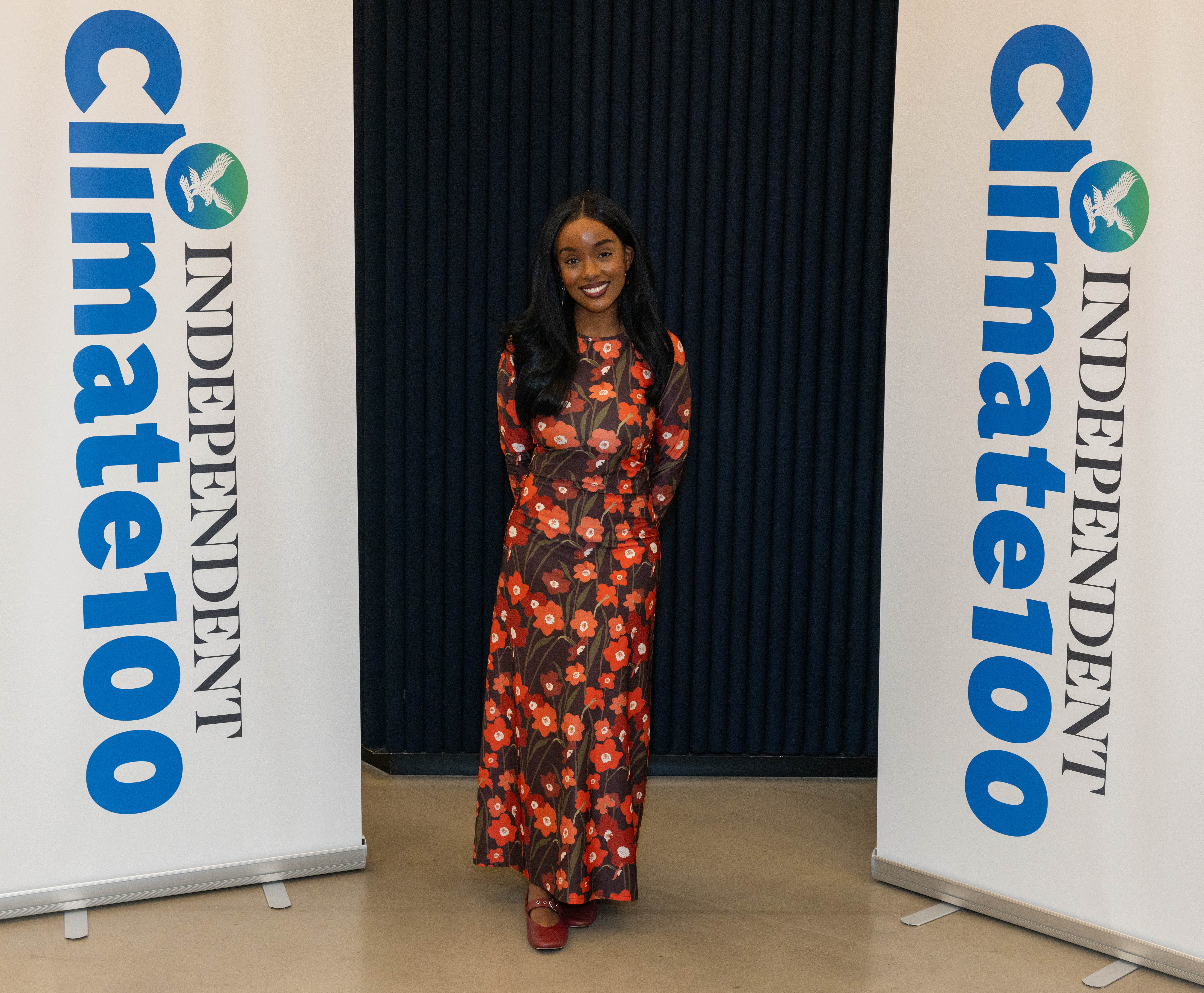 Wawa Gatheru poses in front of the step and repeat for The Independent’s Climate 100 List event, where she stressed the importance of community in the face of the climate crisis