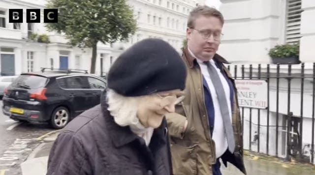 <p>Dr Ann Coxon is approached by reporters outside her home in Notting Hill </p>