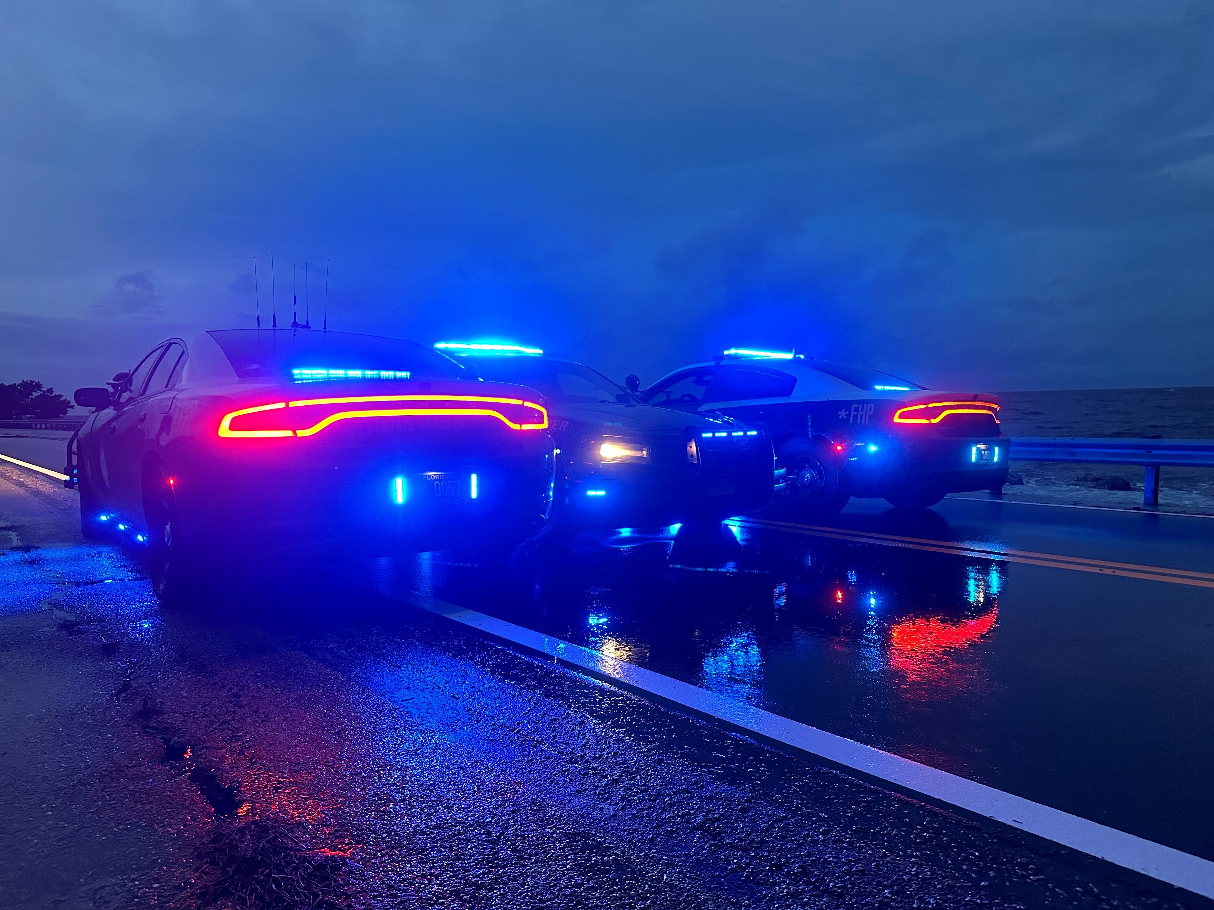 FHP Tampa patrol cars park on the Skyway Bridge