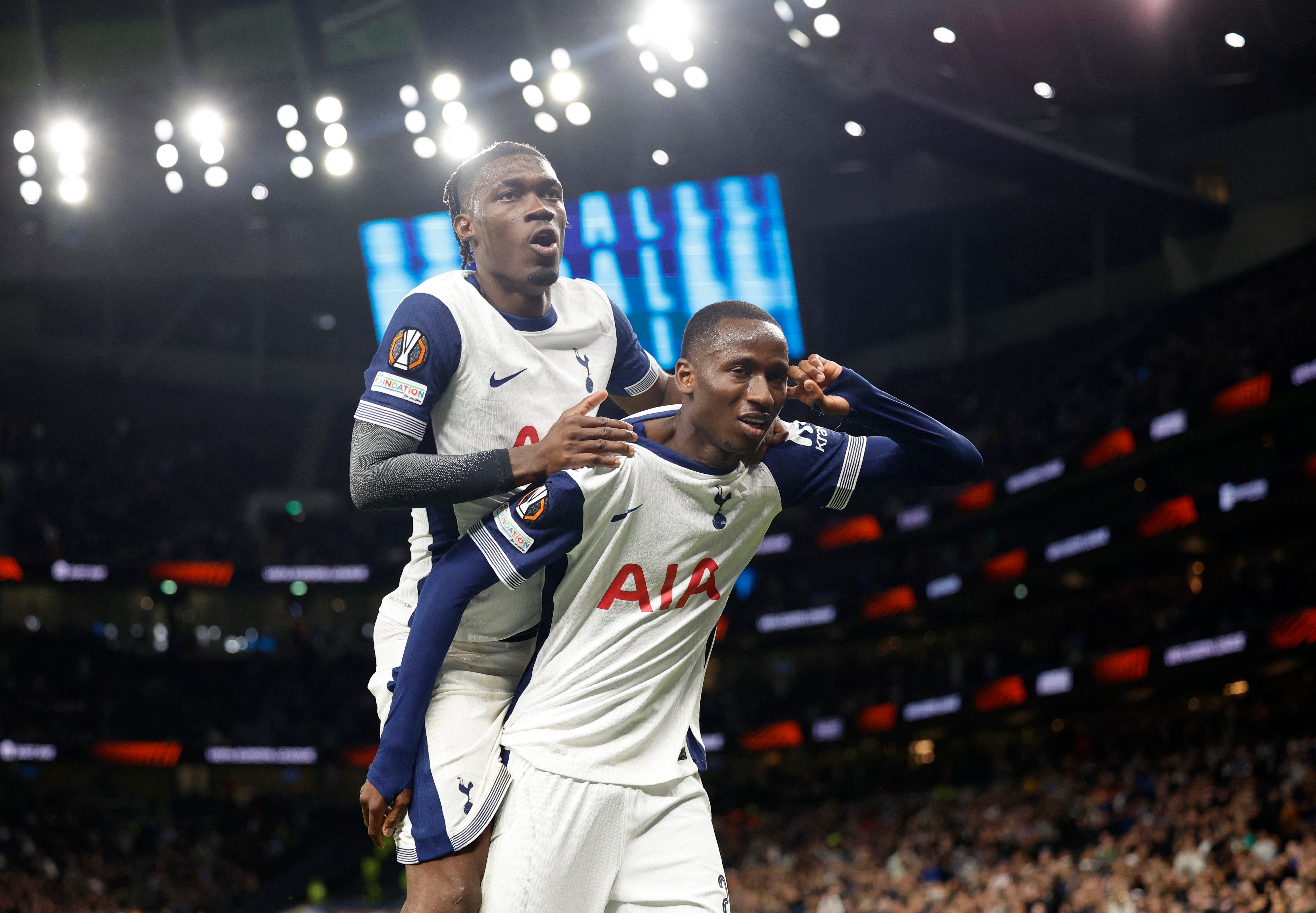 Pape Matar Sarr celebrates scoring their second goal with Yves Bissouma