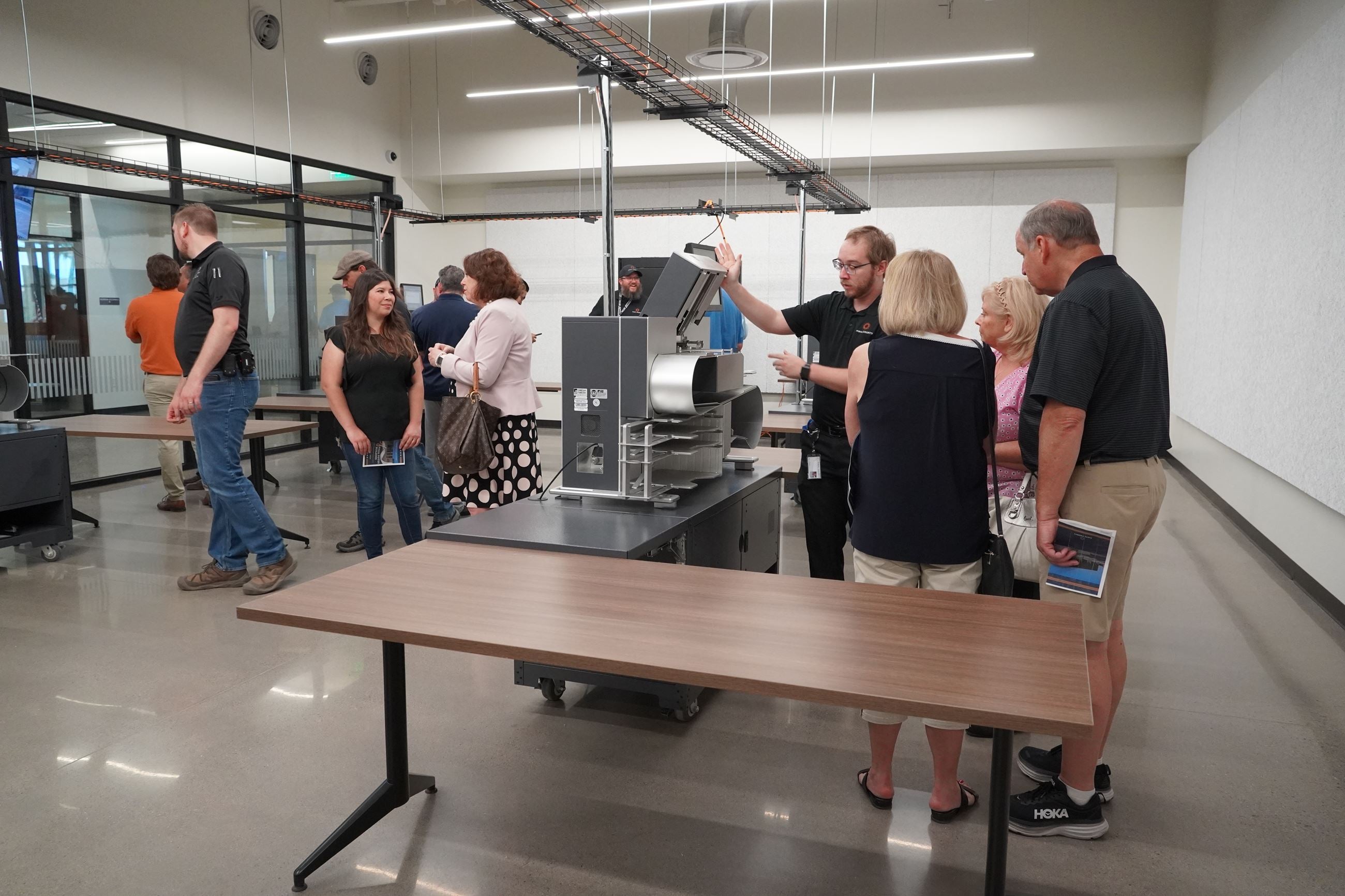 In Pinal County, Arizona, a wall of windows — dubbed the “ fishbowl ” — allows onlookers a 360-degree view to easily watch ballots being counted. People are seen touring the area during an open house