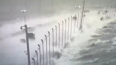 CCTV shows cars driving across Tampa bridge as 130mph winds and dangerous waves from Hurricane Helena crash onto road