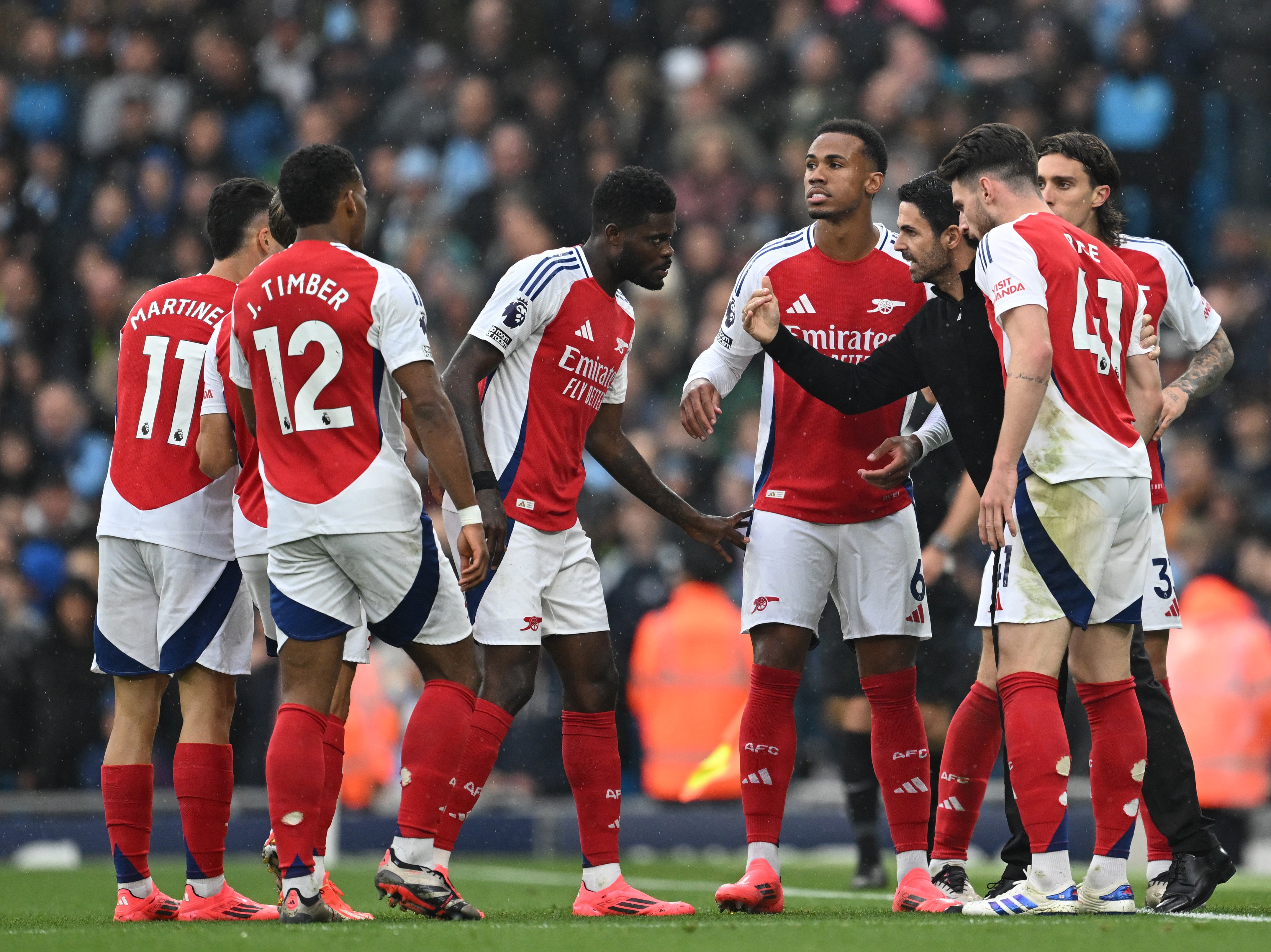 Mikel Arteta passes on instructions during a break in play against Manchester City