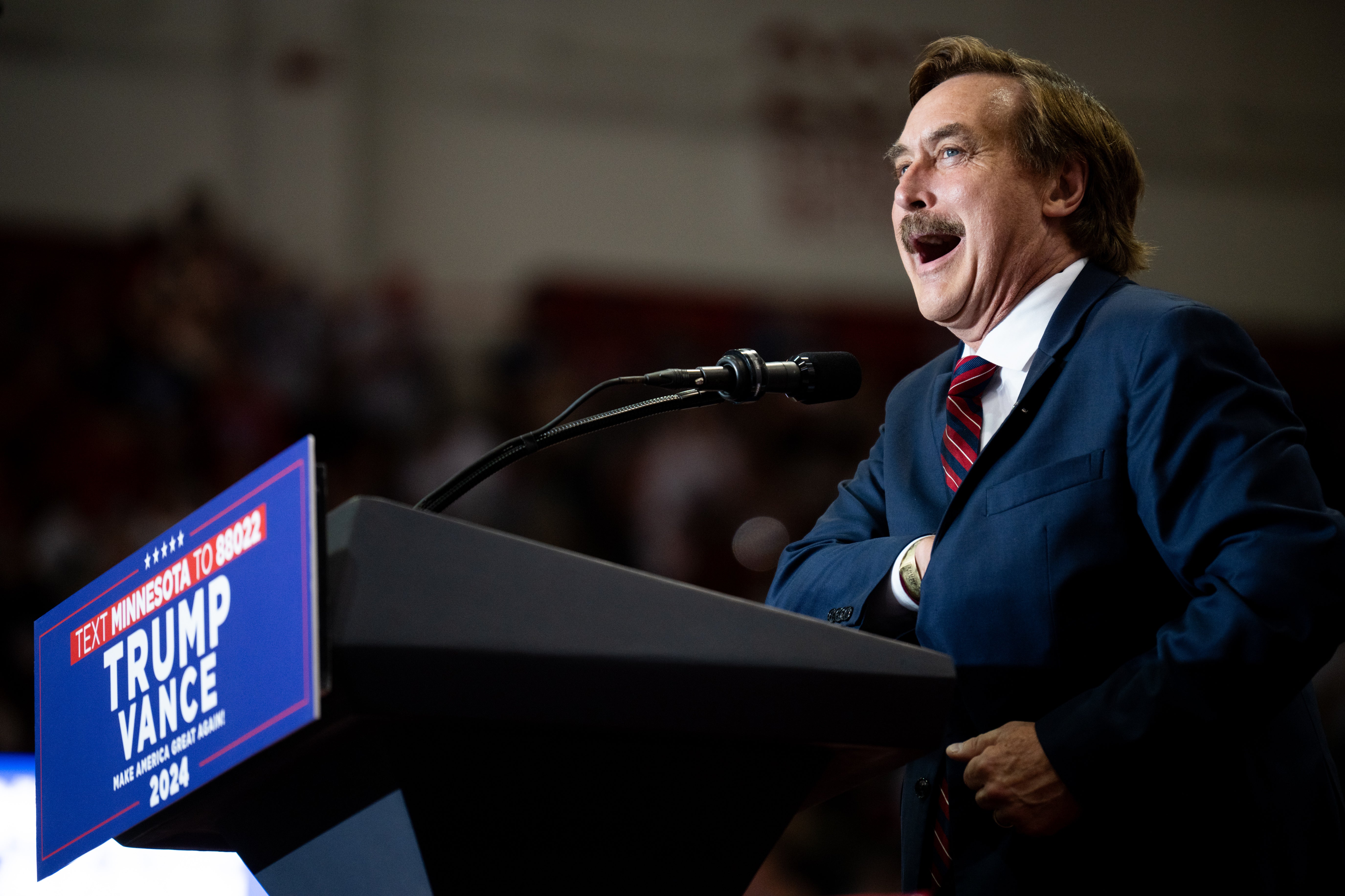 Mike Lindell speaks at a Minnesota rally featuring Trump and JD Vance on July 27 2024. He has claimed ignorance over the hidden meaning behind his pillow prices