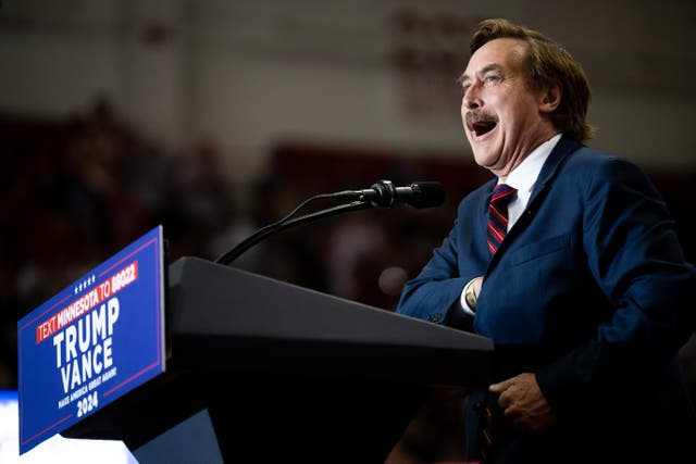 <p>Mike Lindell speaks at a Minnesota rally featuring Trump and JD Vance on July 27 2024. He has claimed ignorance over the hidden meaning behind his pillow prices </p>
