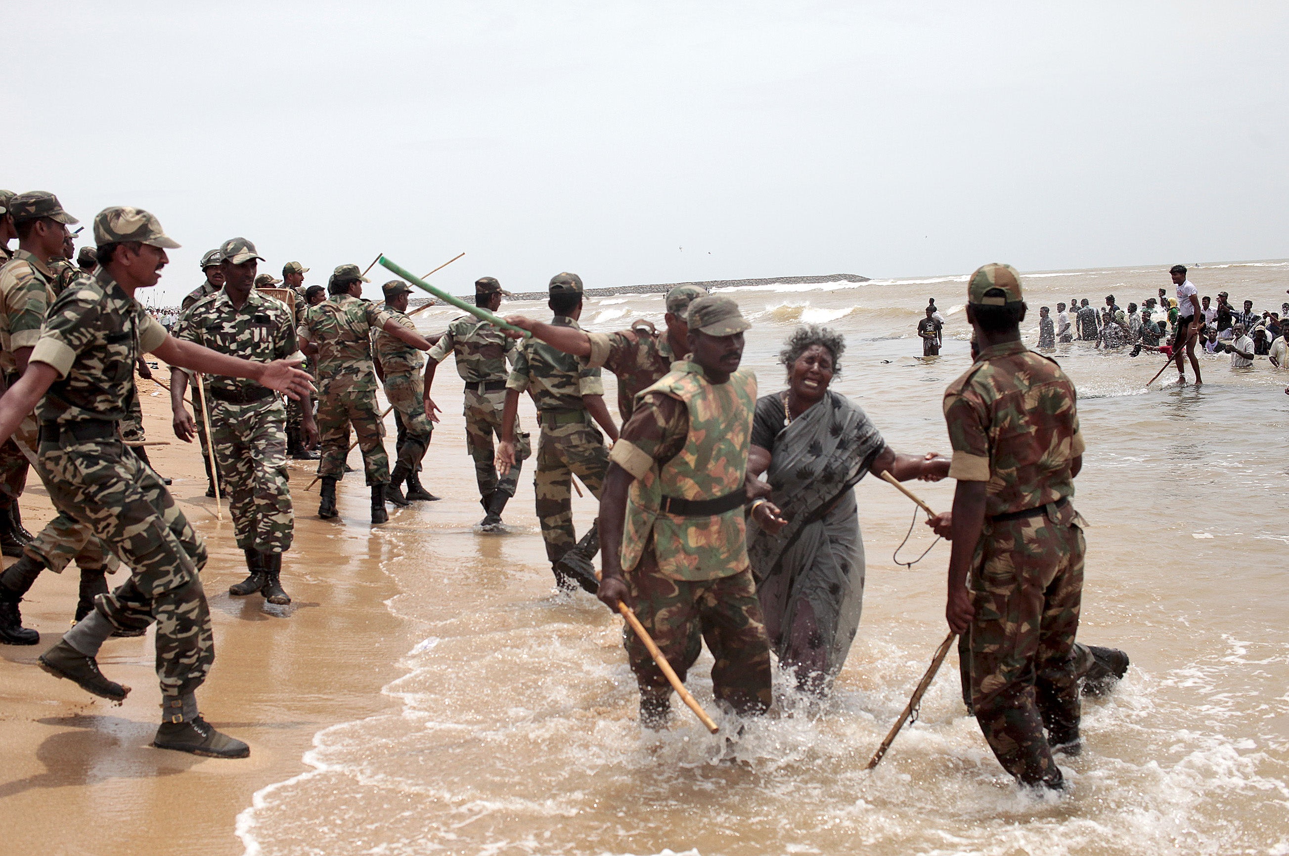 Indian police clash with protestors on the beach at Idinathakarai village near the Kudankulam Nuclear Power Plant on 10 September 2012