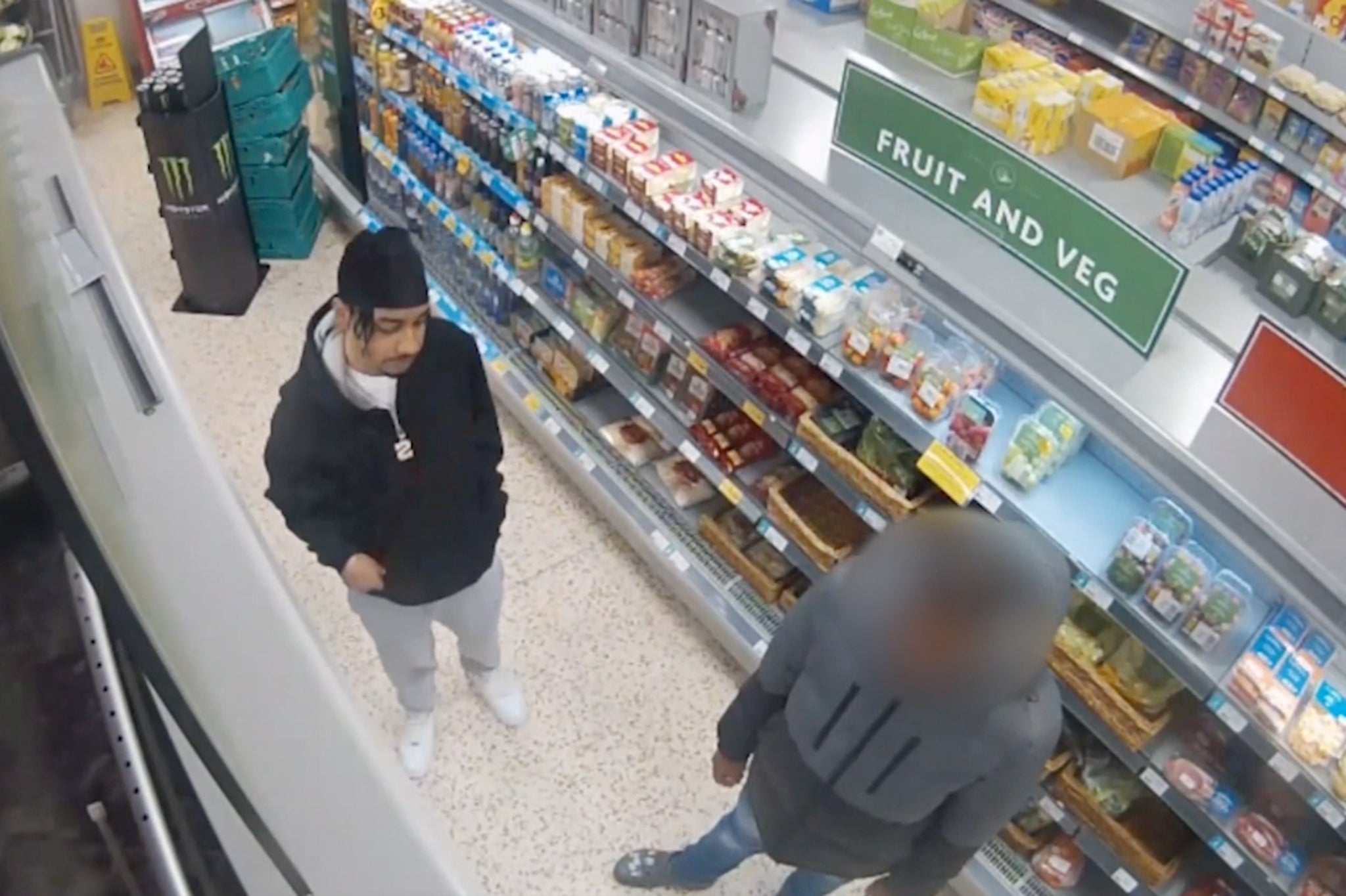 Shawn (right) with a friend in a Wolverhampton shop shortly before machete attack that ended his life