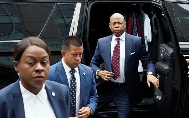 <p>Eric Adams steps out of his car as he arrives at Manhattan federal court on Friday morning</p>